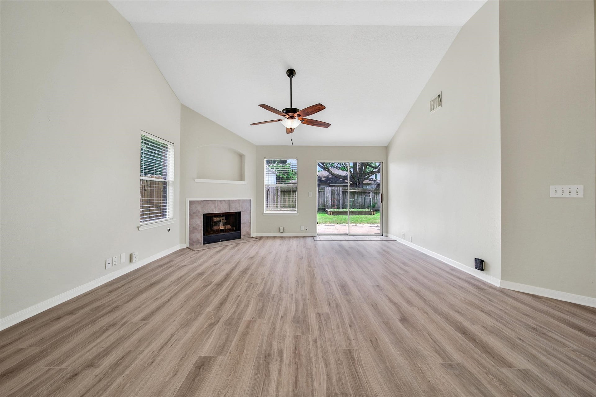 11911 Ezekiel Drive, Tomball, TX 77375 Spacious family room with high ceilings and plenty of space for gatherings.