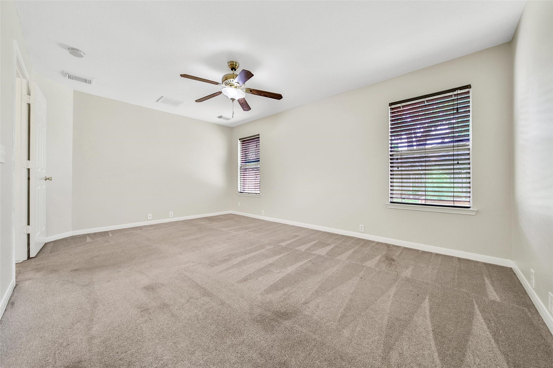 11911 Ezekiel Drive, Tomball, TX 77375 Primary bedroom with ensuite bathroom.