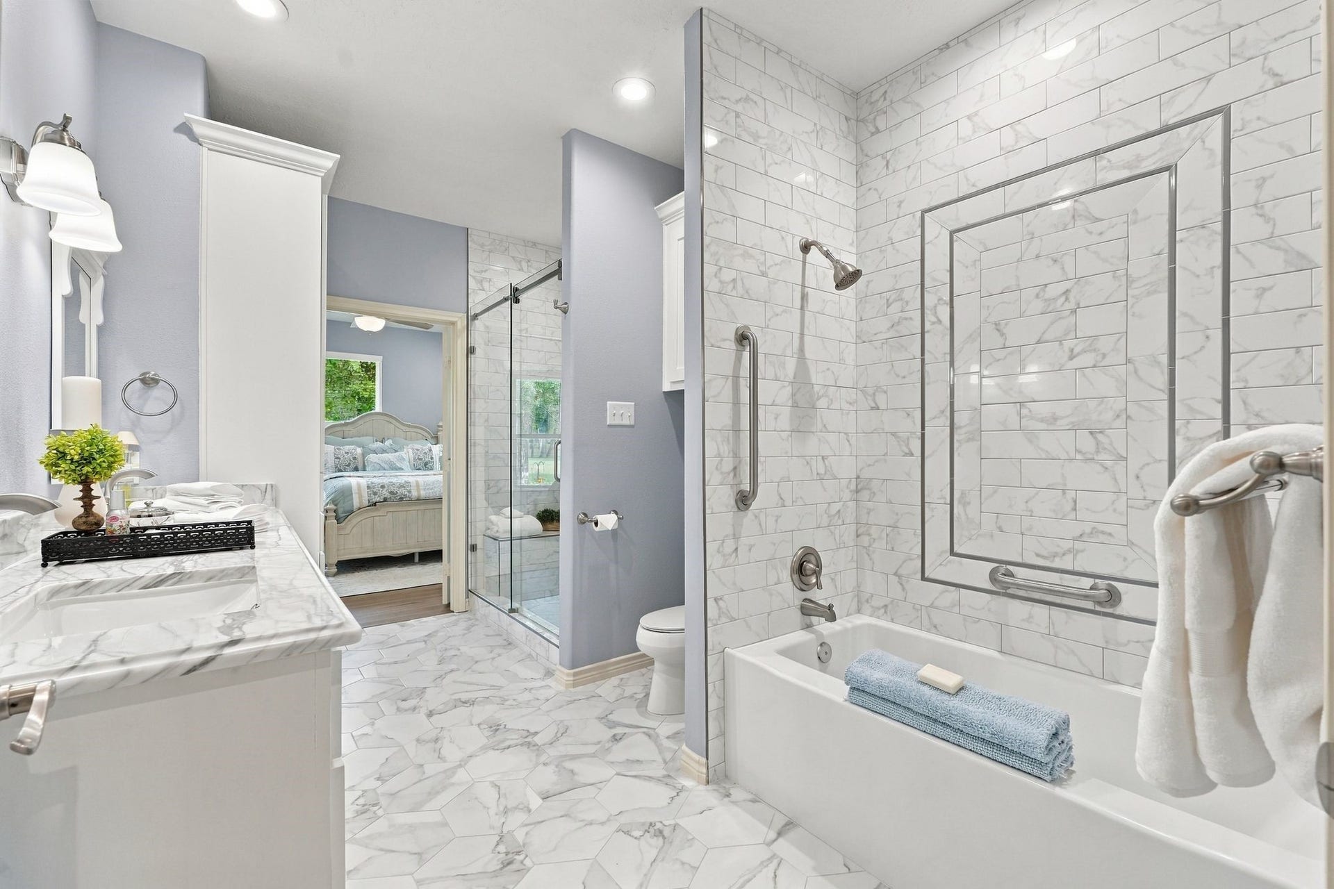 156 April Waters Drive W, Conroe, TX 77356 This is a jack and jill set up for the secondary bathroom. It has been recently updated with marble tile and countertops. Relax in the soaking tub & separate shower.