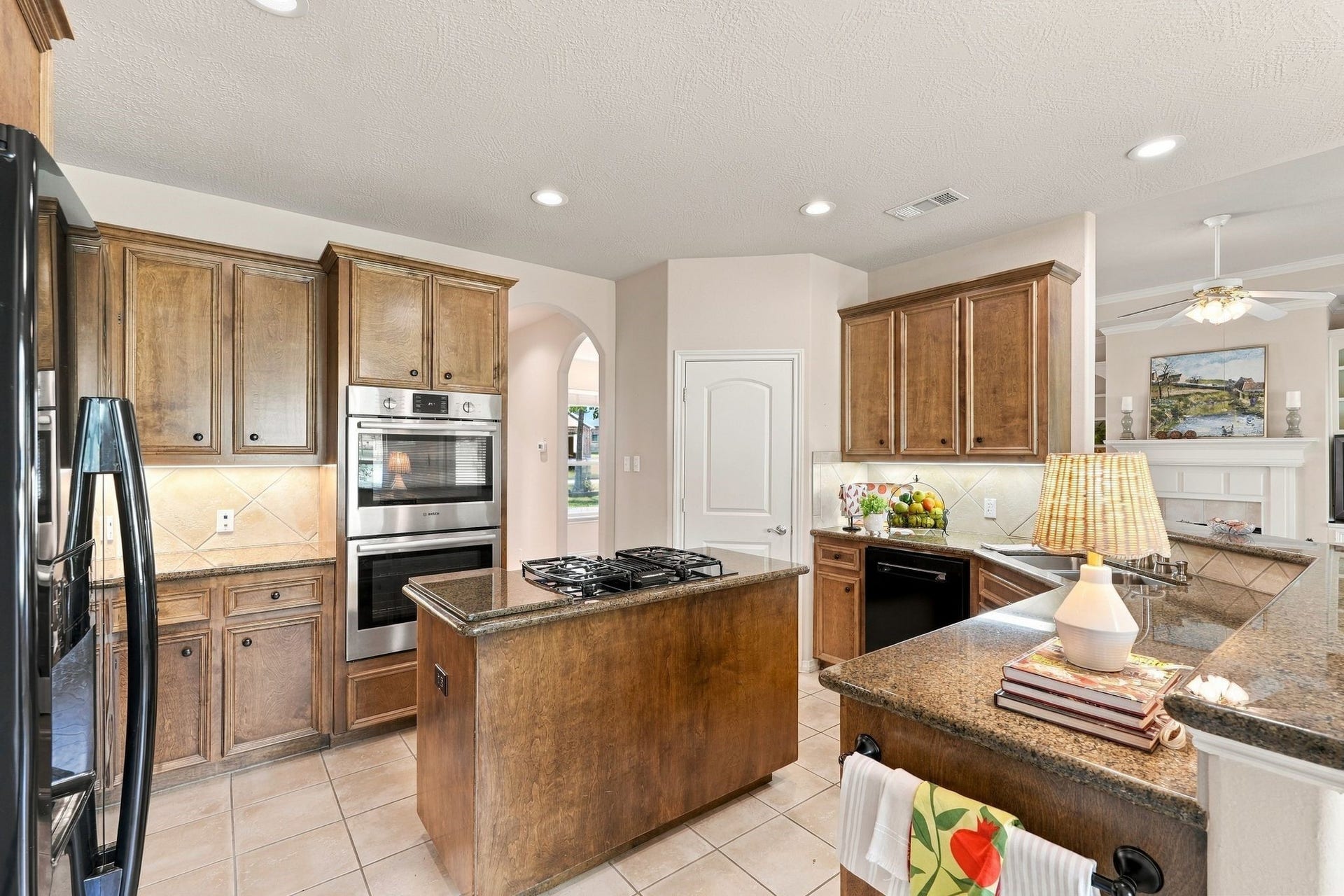 156 April Waters Drive W, Conroe, TX 77356 This kitchen is complete with gas cook top, double ovens and plenty of counter and cupboard space.