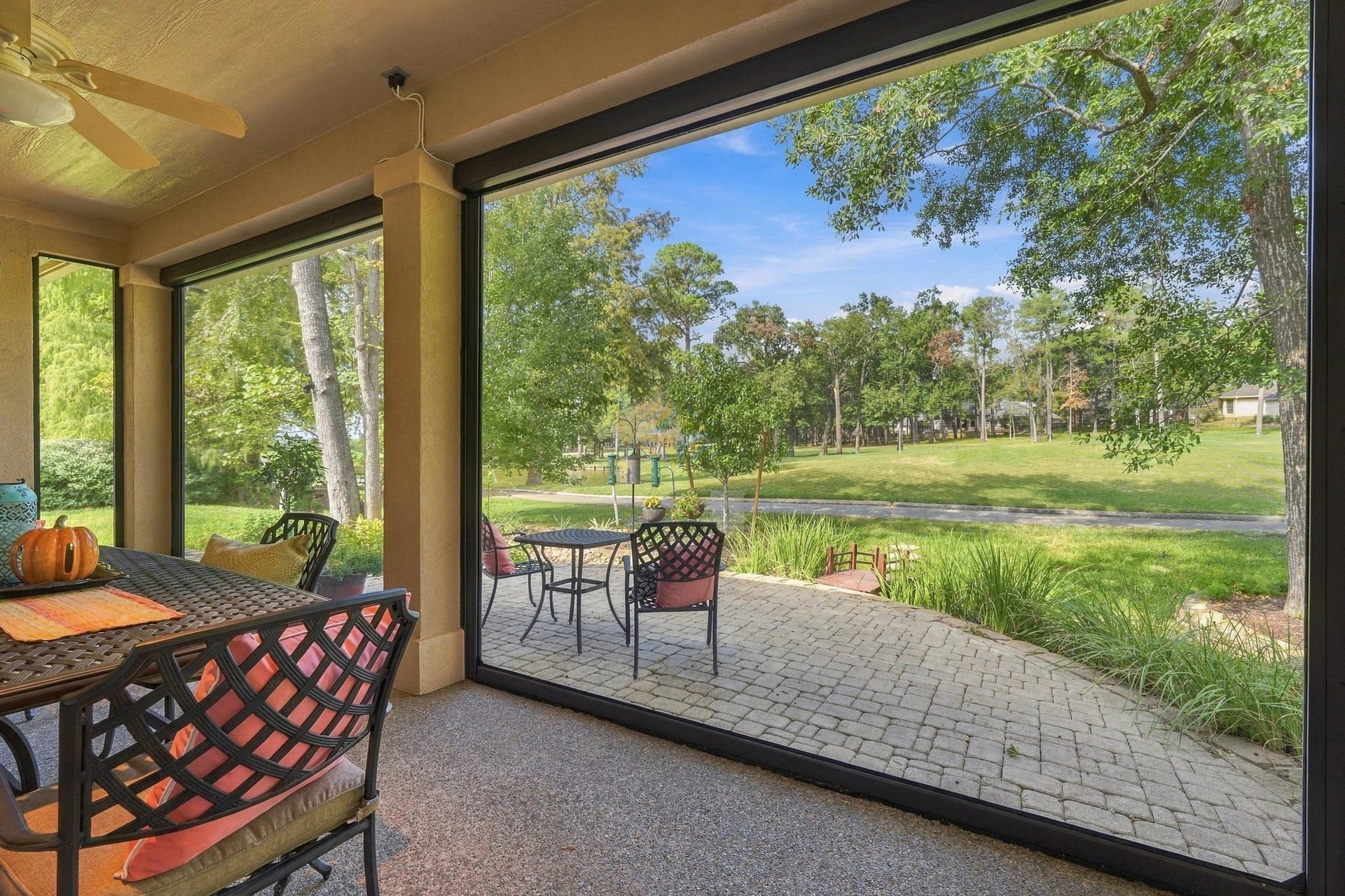 156 April Waters Drive W, Conroe, TX 77356 What a view! This space has recent installation of automatic screens.