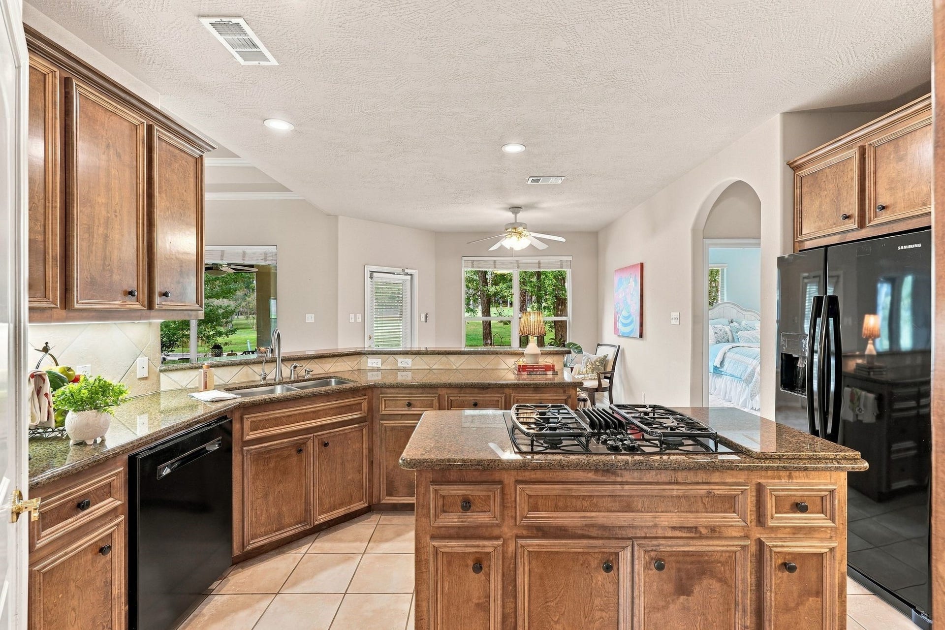 156 April Waters Drive W, Conroe, TX 77356 This kitchen space has a lovely view of the golf course.