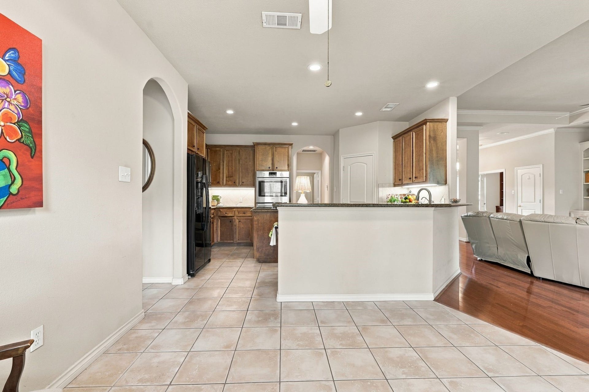 156 April Waters Drive W, Conroe, TX 77356 View if the kitchen with a breakfast bar.
