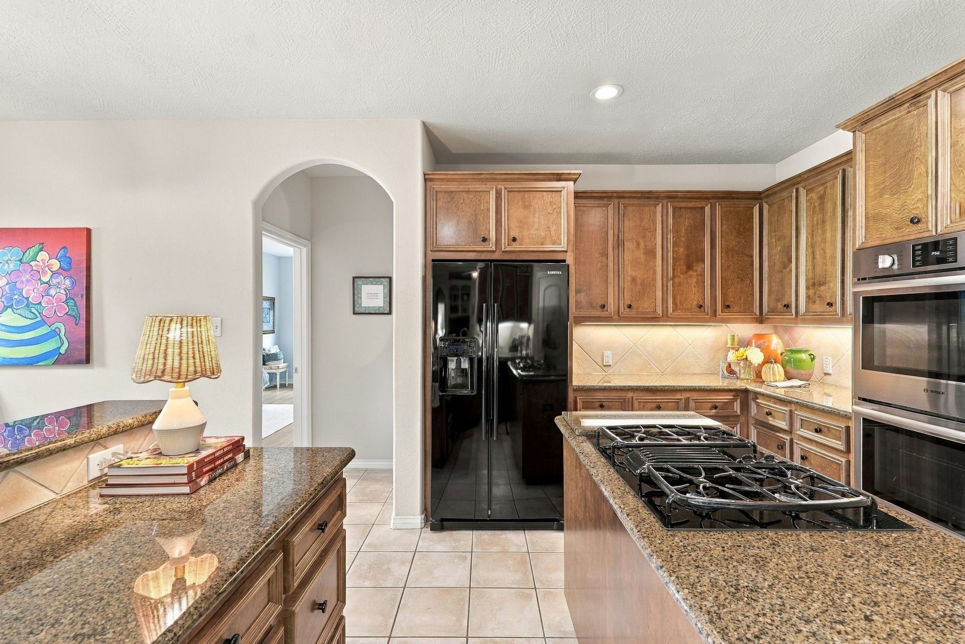 156 April Waters Drive W, Conroe, TX 77356 2nd Primary Suite through the doorway. Refrigerator conveys with the home.
