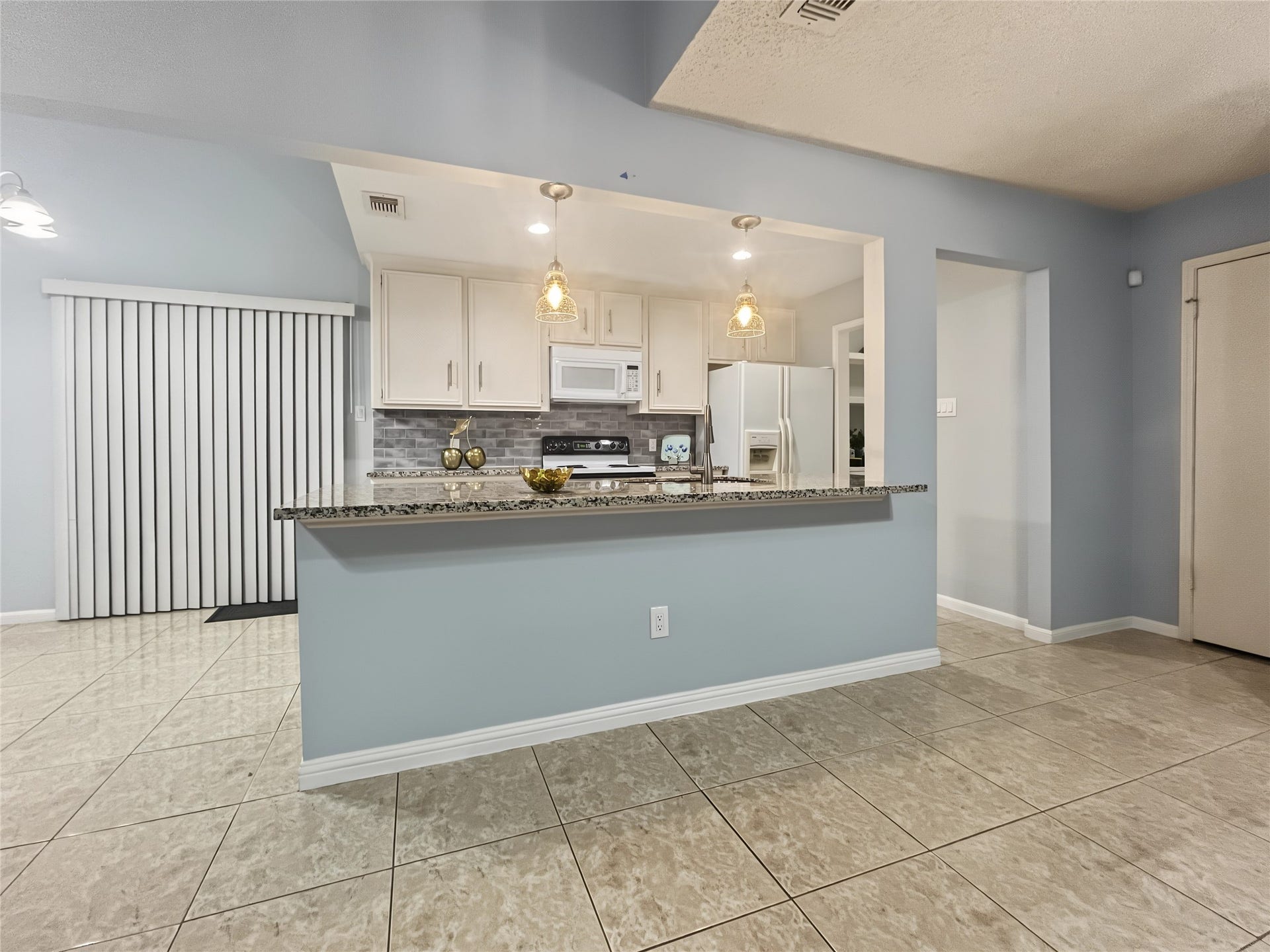 13768 Hollowgreen Drive, #510, Houston, TX 77082 View of the kitchen from the living and social areas.