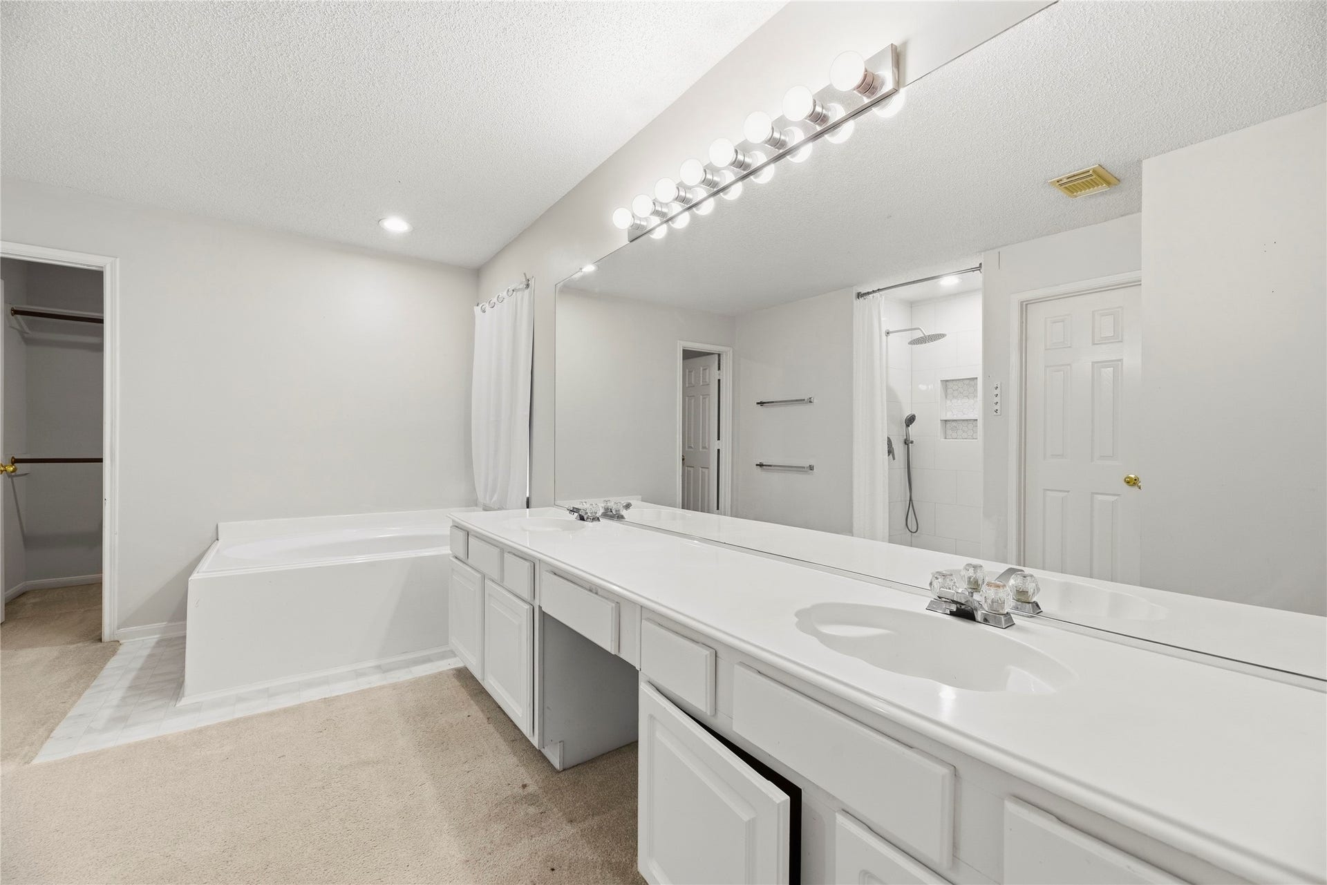 9922 W Cedaredge Drive, Houston, TX 77064 Primary bathroom offers dual vanities, soaking tub, stand alone shower, and two walk in closets.
