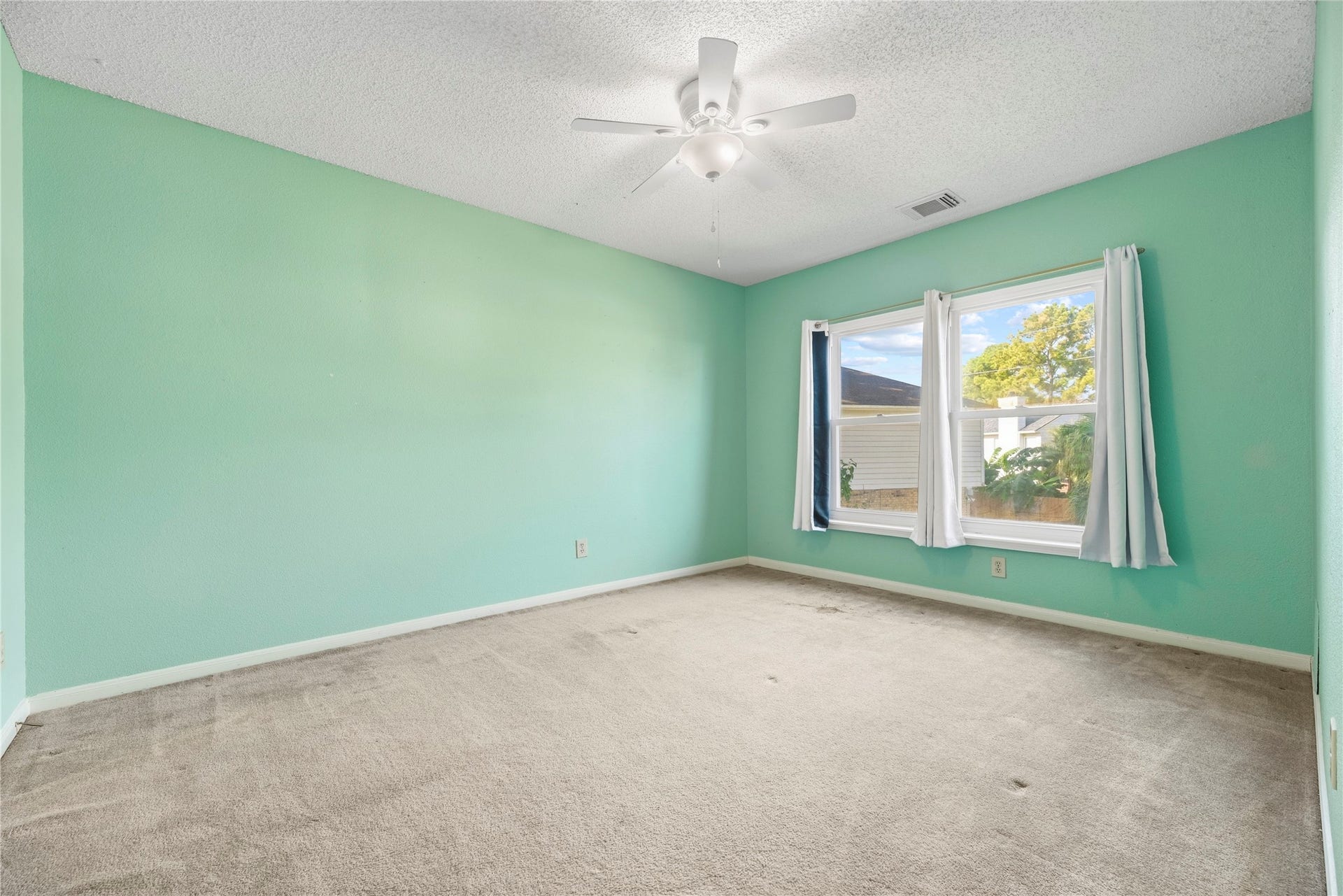 9922 W Cedaredge Drive, Houston, TX 77064 Secondary bedroom #3 offers large window and abundant natural light.