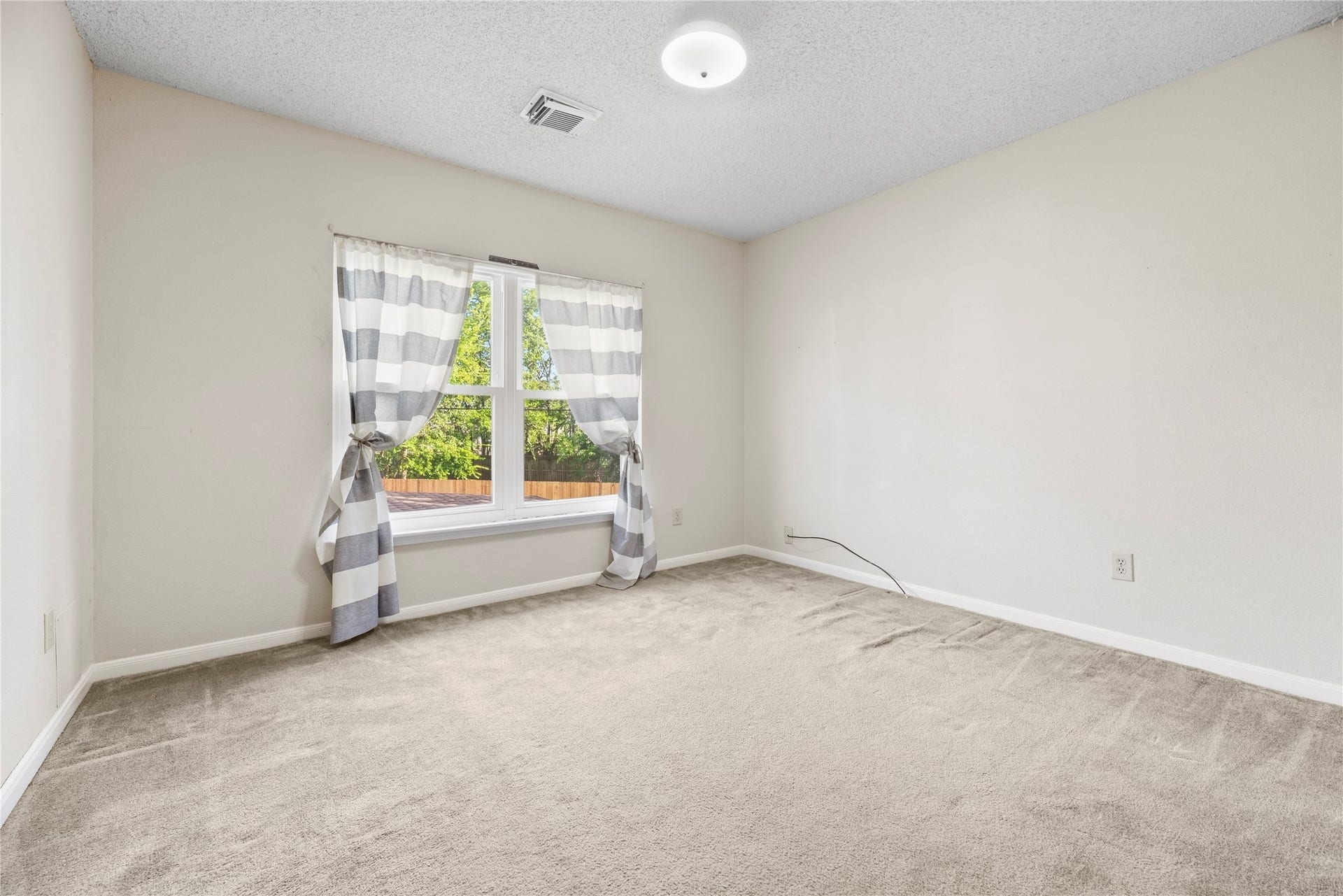 9922 W Cedaredge Drive, Houston, TX 77064 4th secondary bedroom again boasts large window overlooking the backyard creating a peaceful retreat.