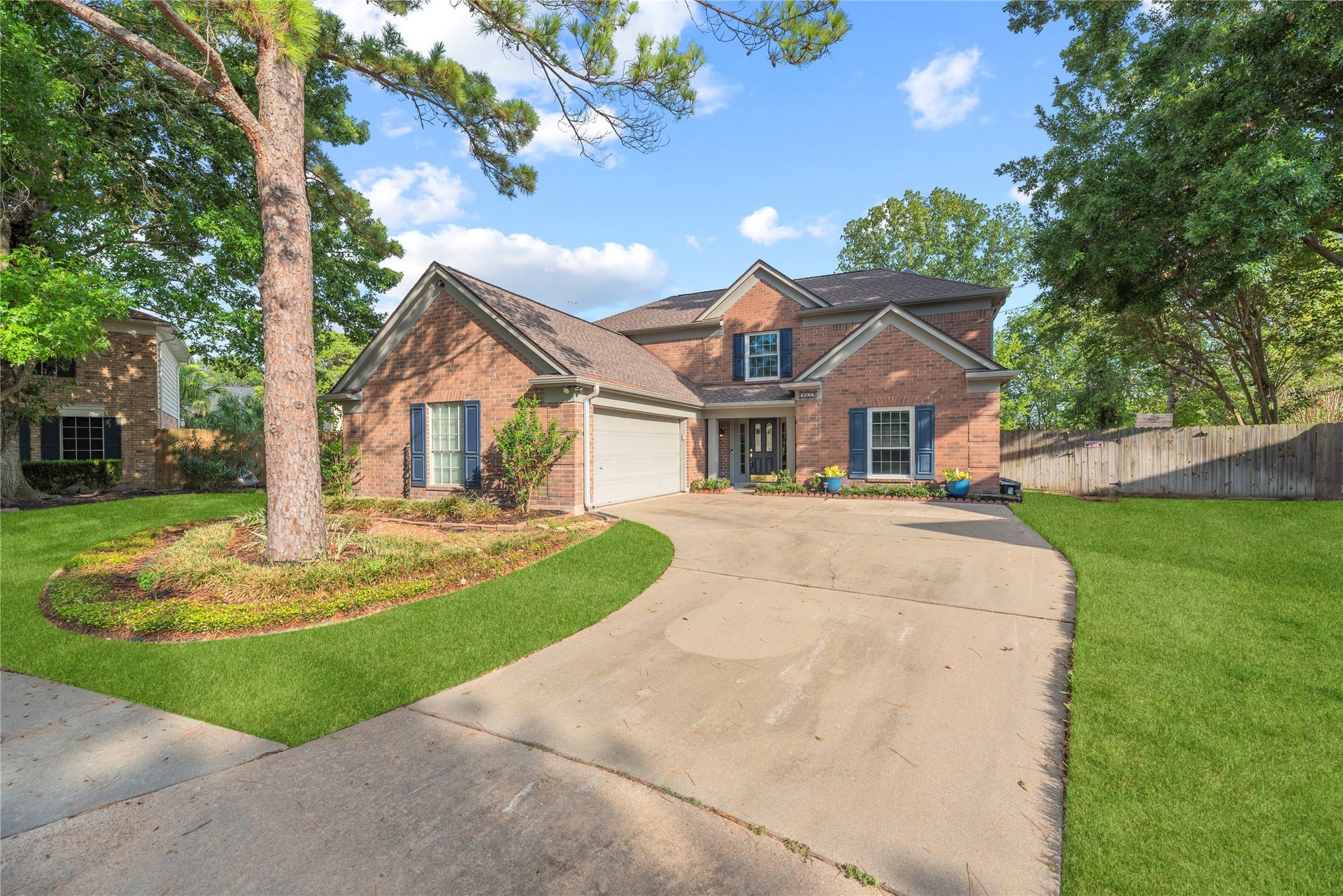 9922 W Cedaredge Drive, Houston, TX 77064 Home is nestled amidst mature trees.