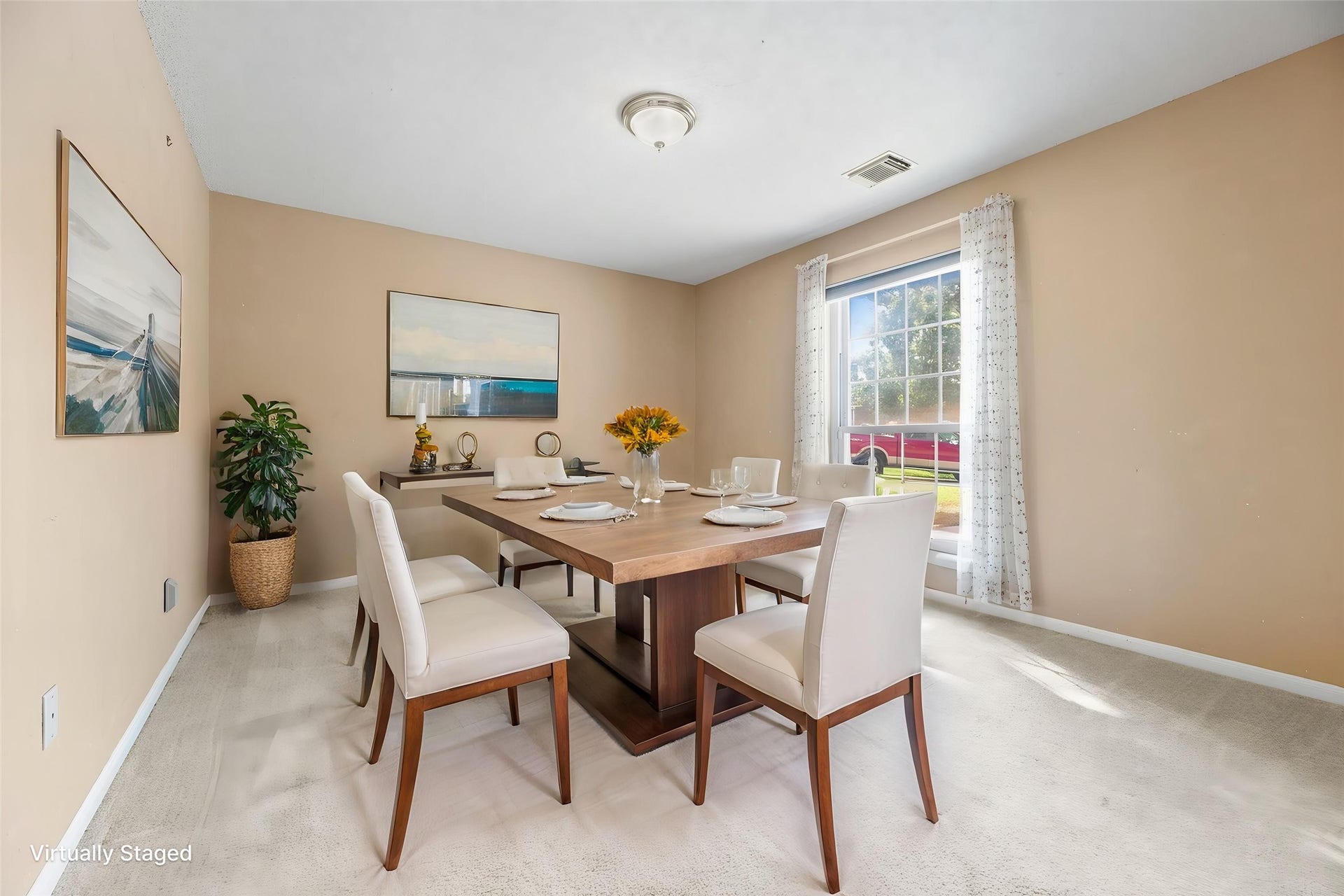 9922 W Cedaredge Drive, Houston, TX 77064 Virtually Staged -- Bright and inviting dining room featuring a large window with neutral walls perfect for entertaining guests.