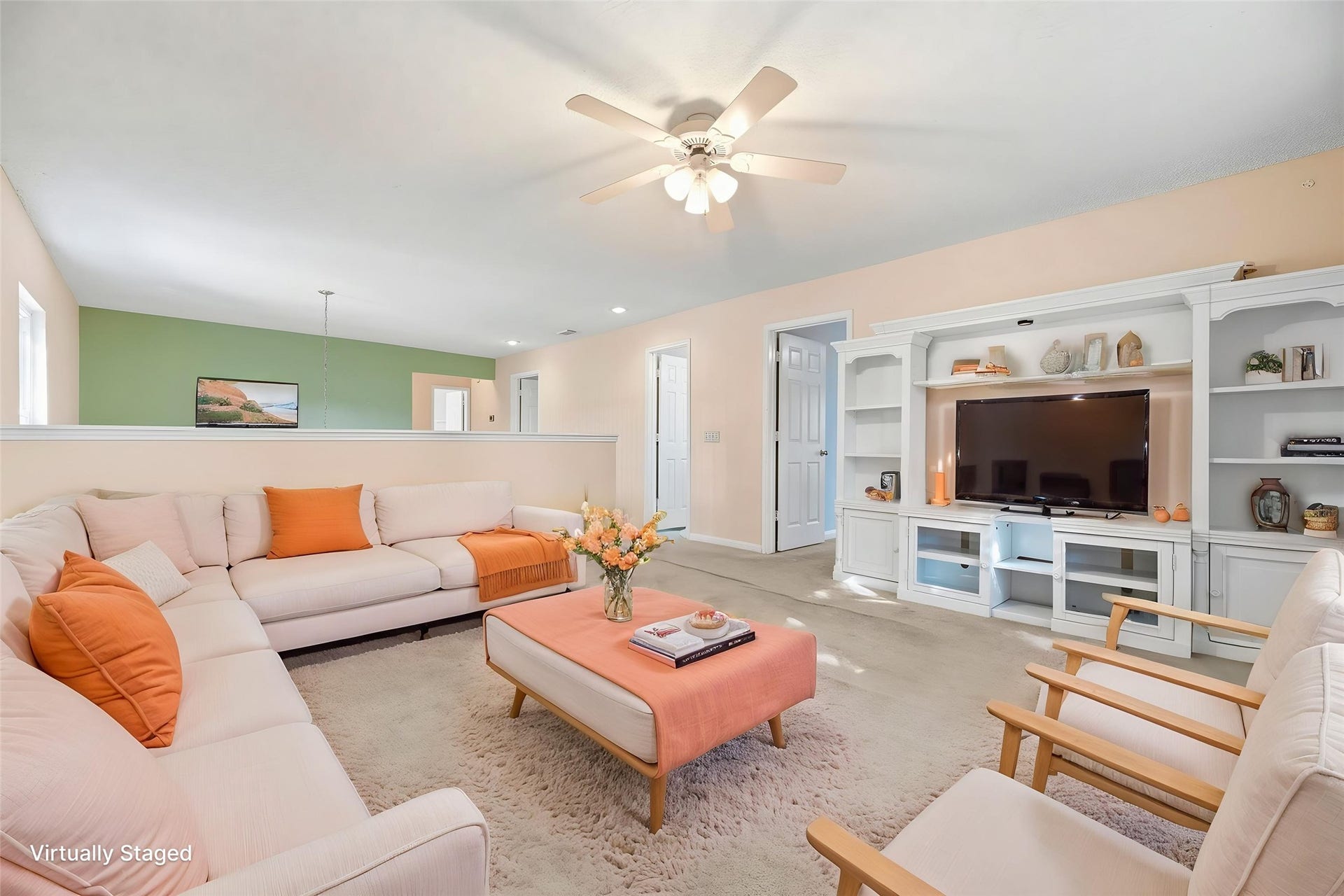 9922 W Cedaredge Drive, Houston, TX 77064 Virtually Staged -- Spacious upstairs living room/game room space featuring a ceiling fan, built-in entertainment unit perfect for relaxation, play and gatherings.