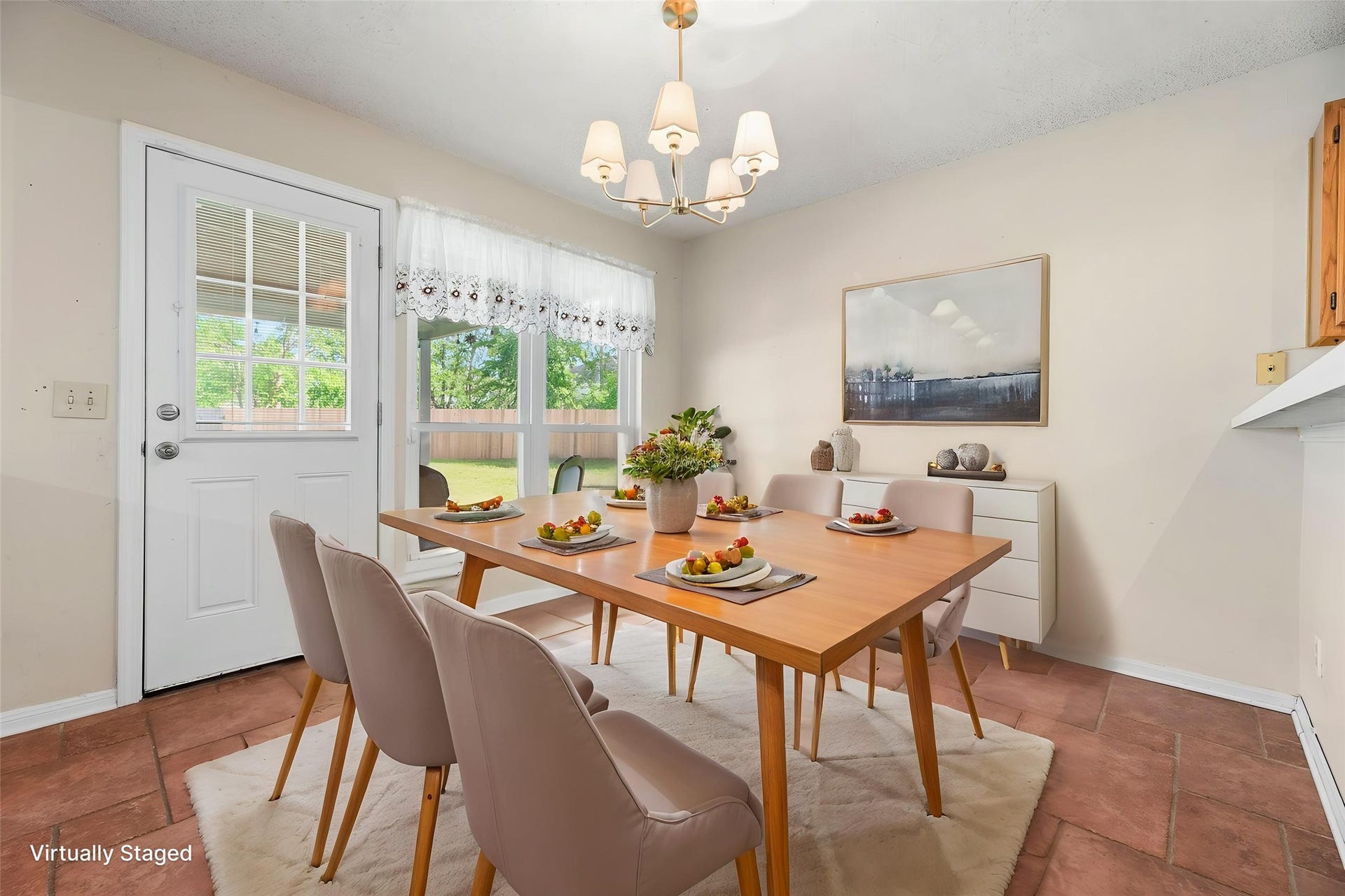 9922 W Cedaredge Drive, Houston, TX 77064 Virtually Staged -- Bright breakfast area with terracotta tile flooring and large windows offering a view of the backyard.