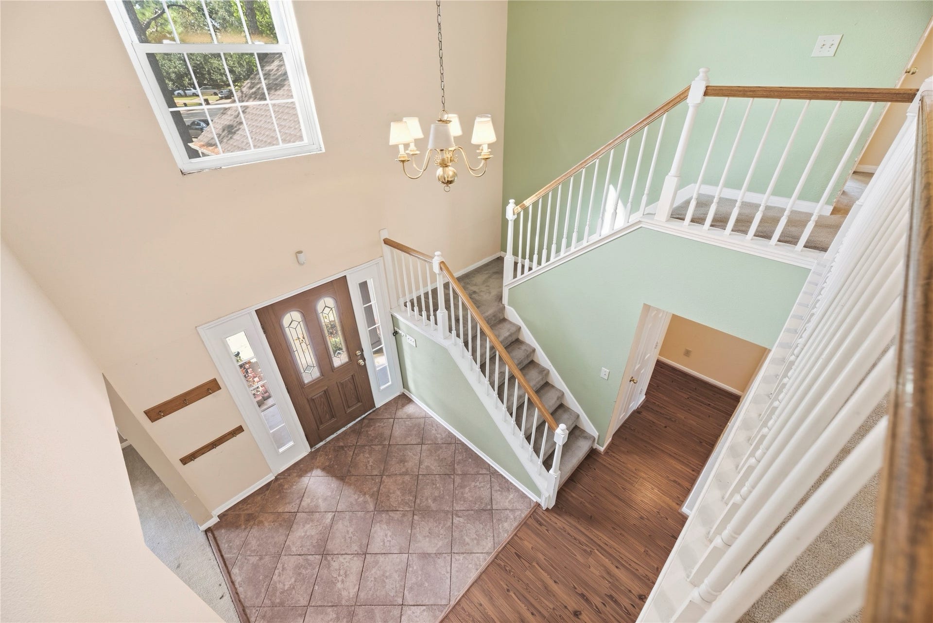 9922 W Cedaredge Drive, Houston, TX 77064 Bright and spacious entryway with a high ceiling with staircase leading to the upper level.