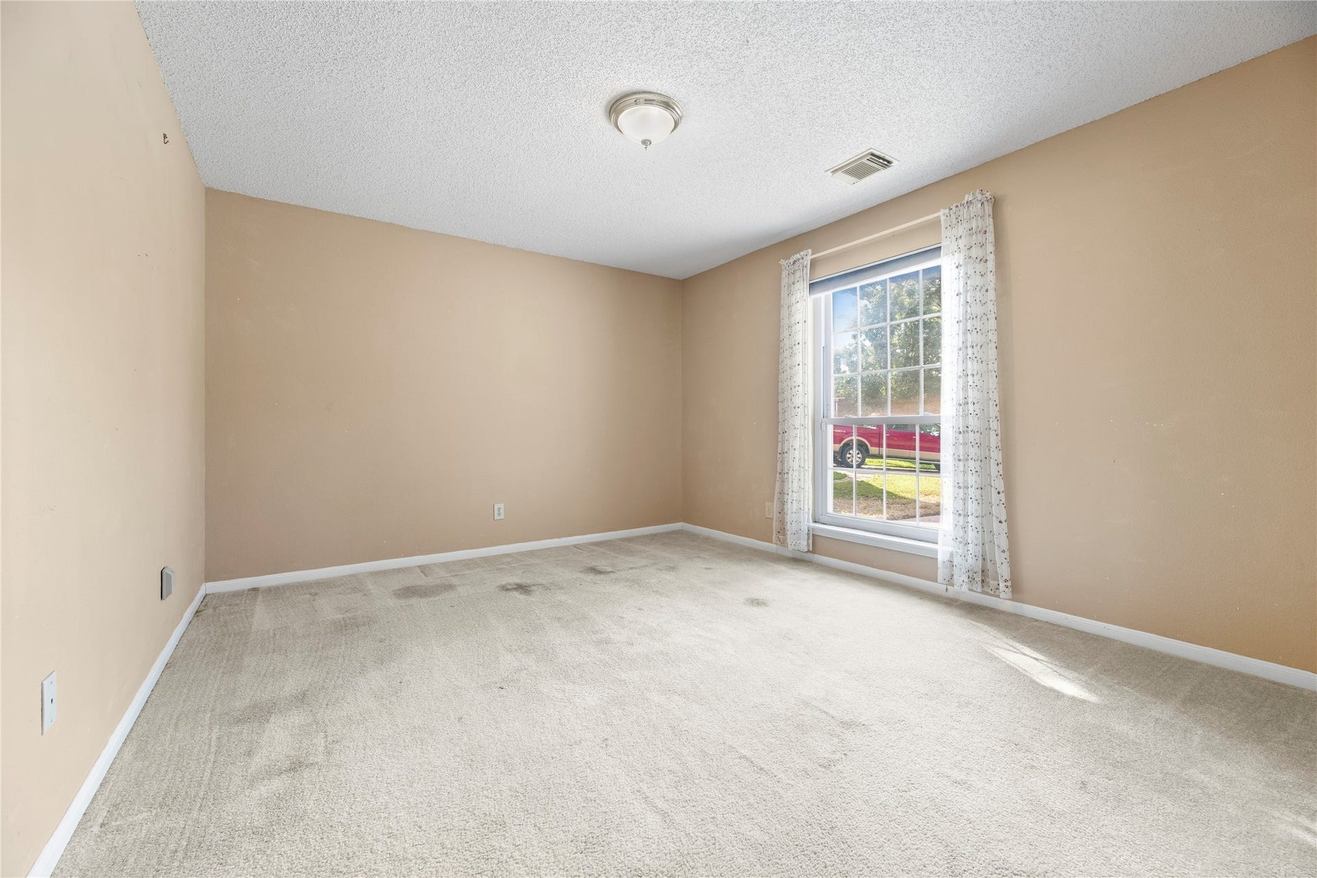 9922 W Cedaredge Drive, Houston, TX 77064 Bright and inviting dining room featuring a large window with neutral walls perfect for entertaining guests.