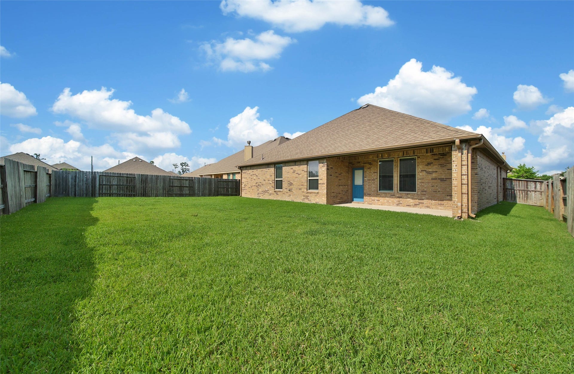 15423 Hopkins Cedar Drive, Humble, TX 77346 Full brick exterior with gutters