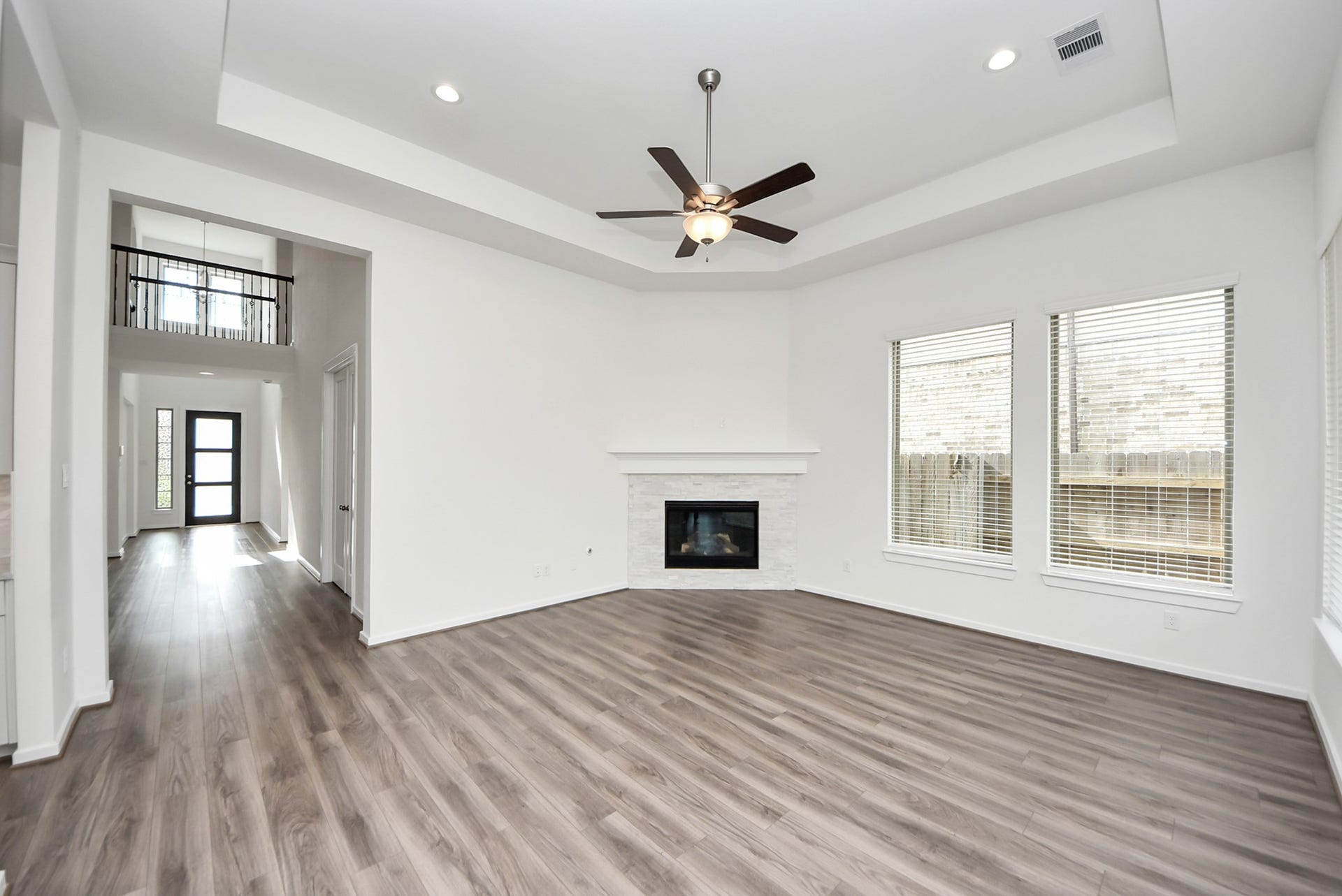 7319 Perching Hawk Trail, Katy, TX 77493 Living room with view of entryway.