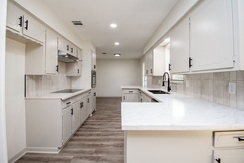 729 Arbor Drive, Deer Park, TX 77536 Updated kitchen with breakfast bar and ample cabinetry