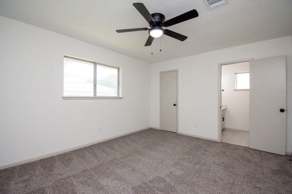 729 Arbor Drive, Deer Park, TX 77536 Primary bedroom with updated flooring and natural light