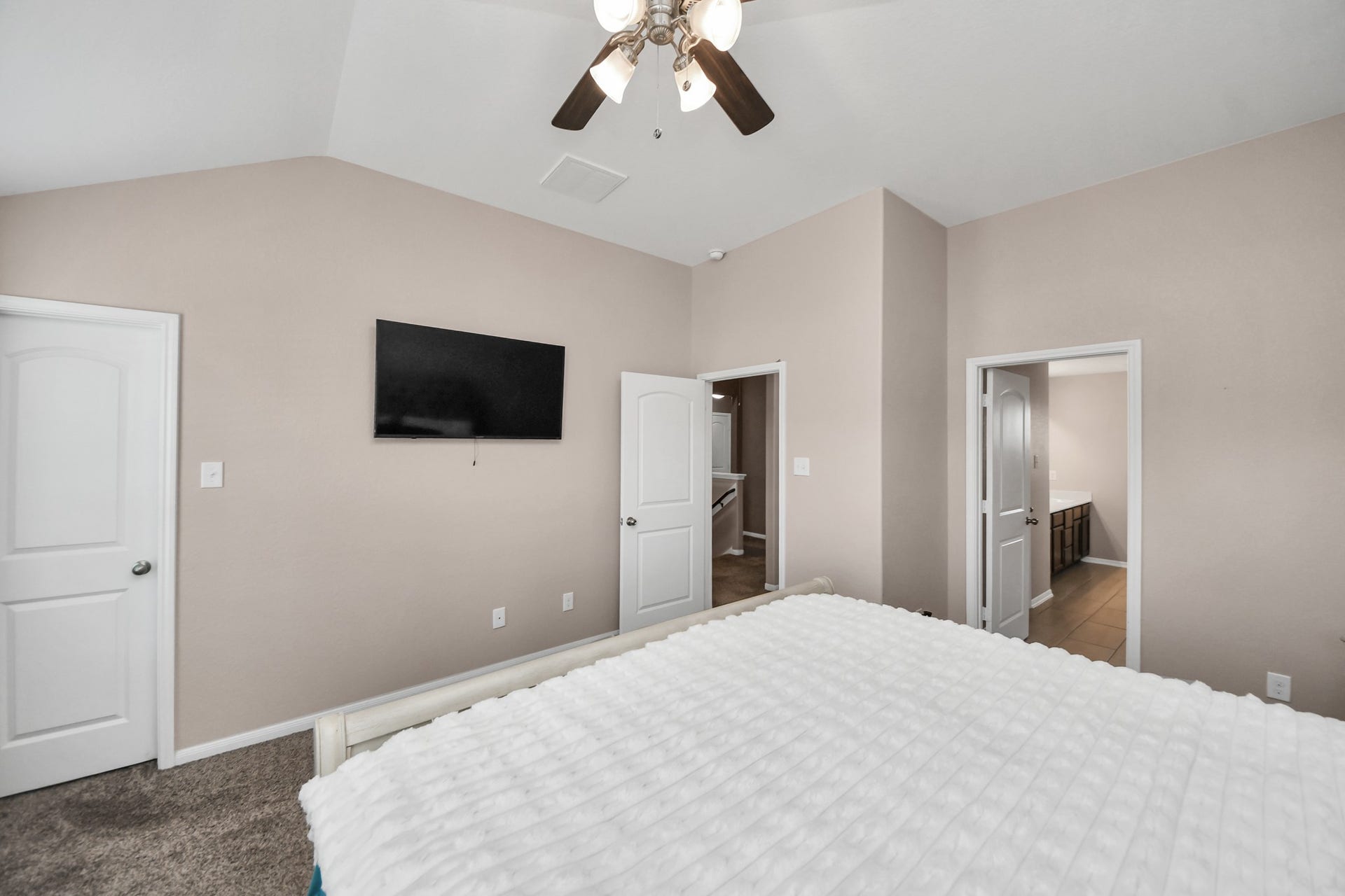 The primary suite offers two closetsone within the bedroom and an additional closet conveniently located in the ensuite bathroom.