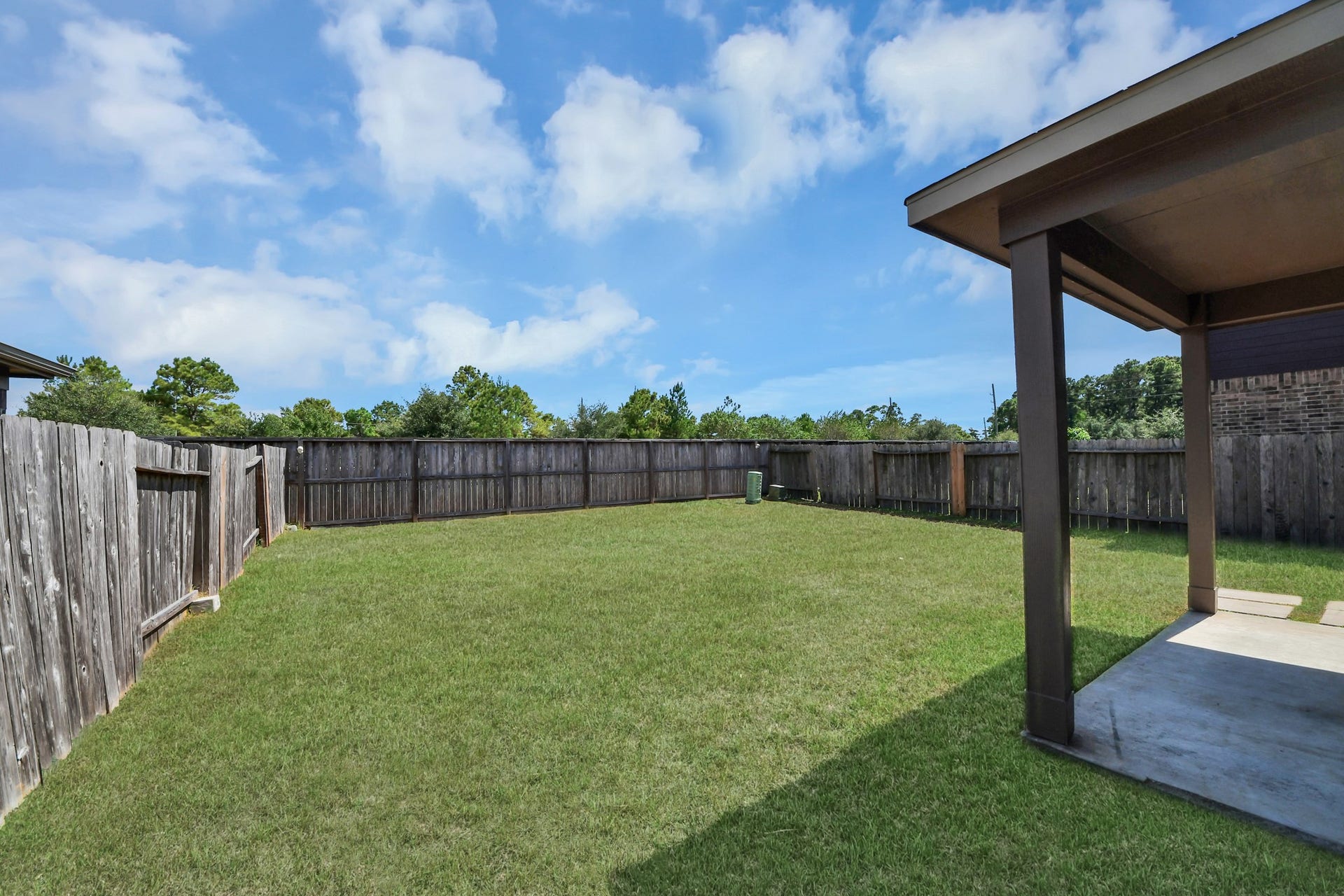 Easy access from the covered patio creates a seamless setting for everyday outdoor living.
