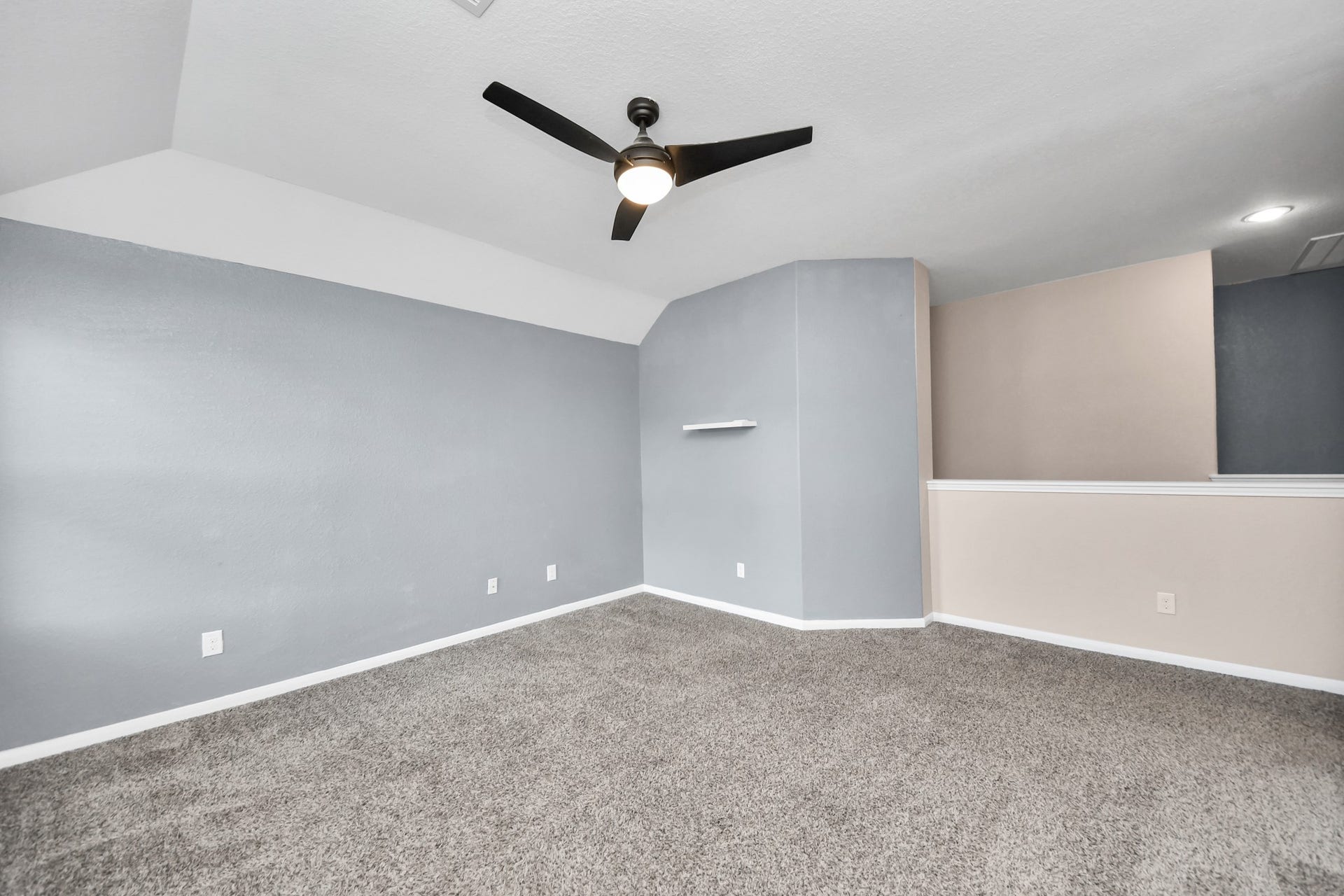 High ceilings and an open design make this game/flex room feel spacious, airy and full of possibilities.