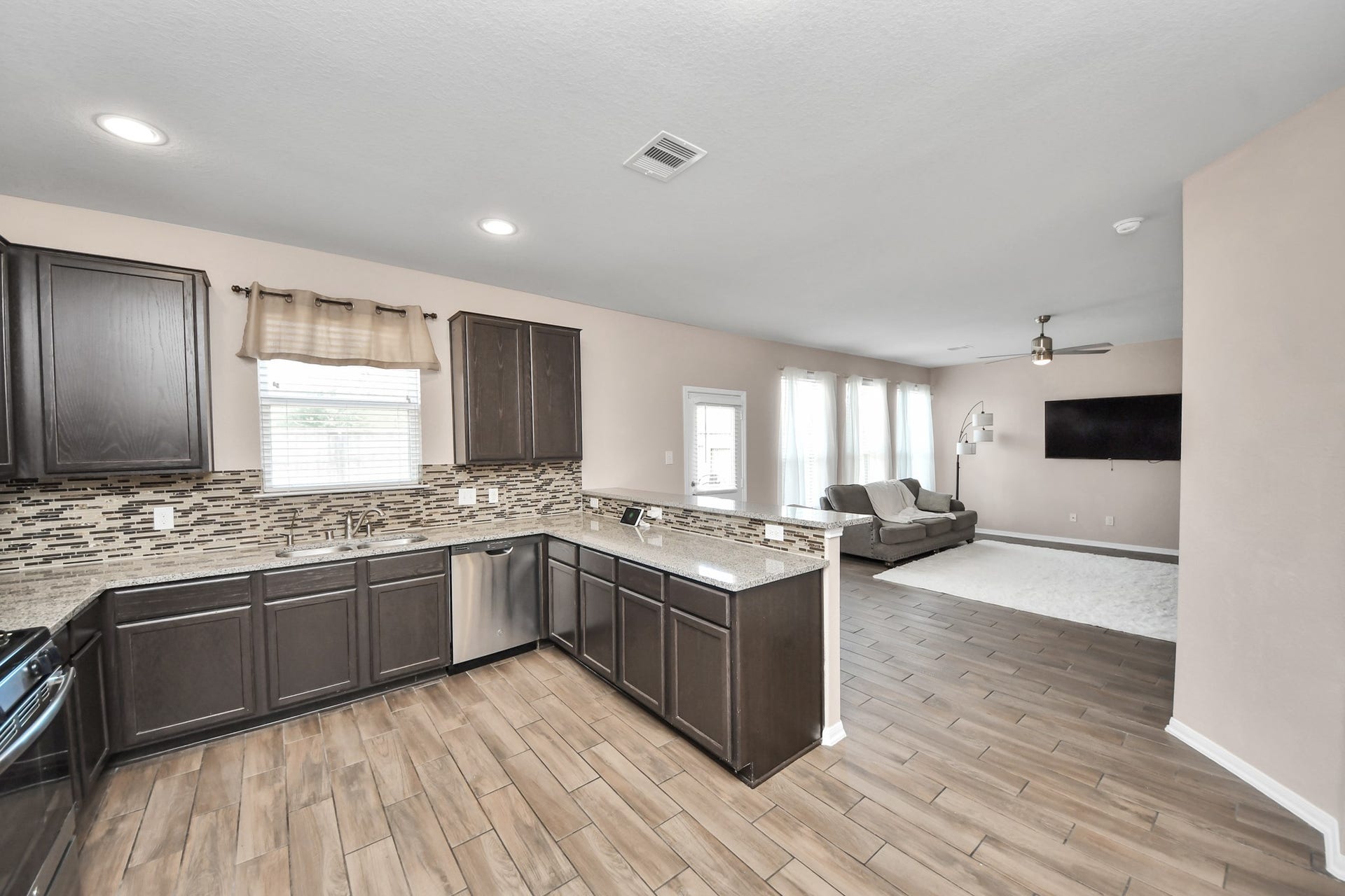 Open-concept design creates a seamless flow between the kitchen and living area, ideal for entertaining and everyday living.