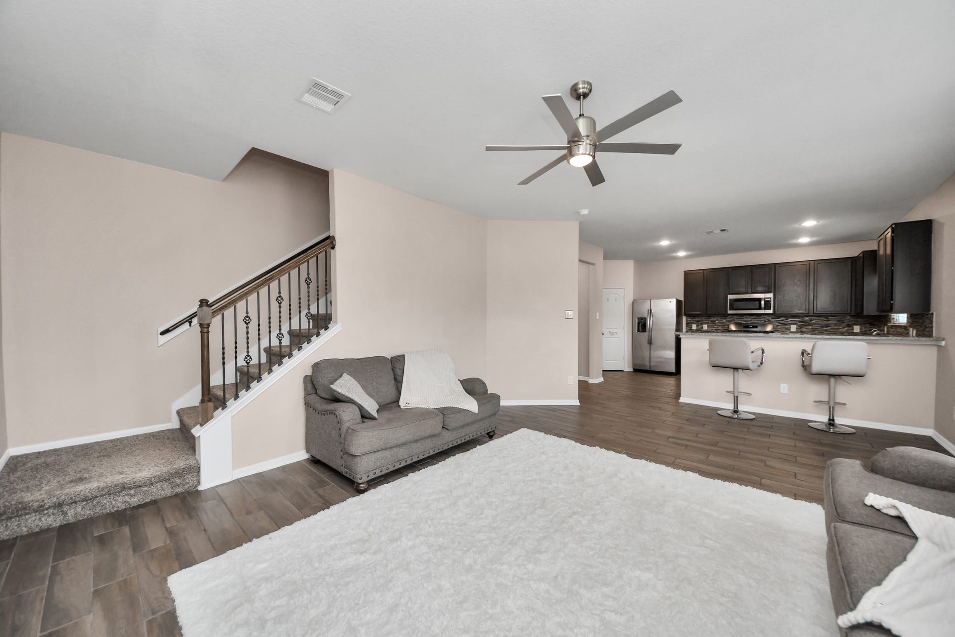 Spacious living area with high ceilings that create an open and inviting atmosphere.