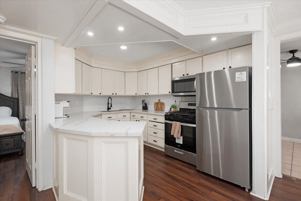 215 Caplin Street, Houston, TX 77022 Downstairs Kitchen with ample cabinet and counter space.