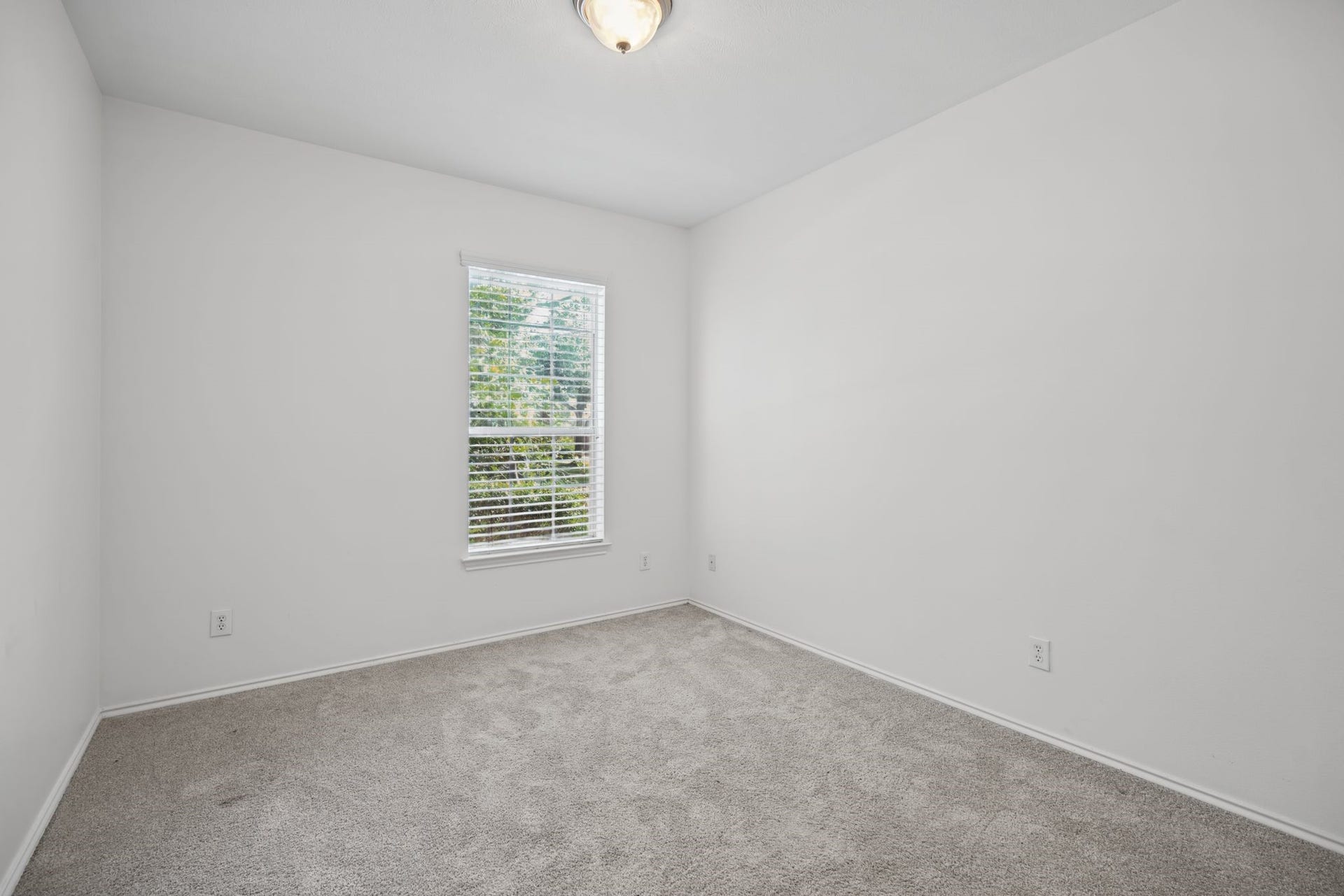 A second downstairs bedroom offers a welcoming space for guests or a great option for multigenerational living.