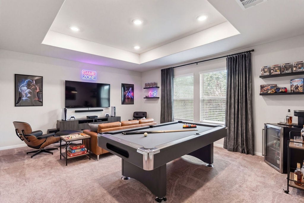 6623 Blimp Base Blvd, Hitchcock, TX 77563 A virtual staged look of the game room upstairs. Possible game/movie night room.
