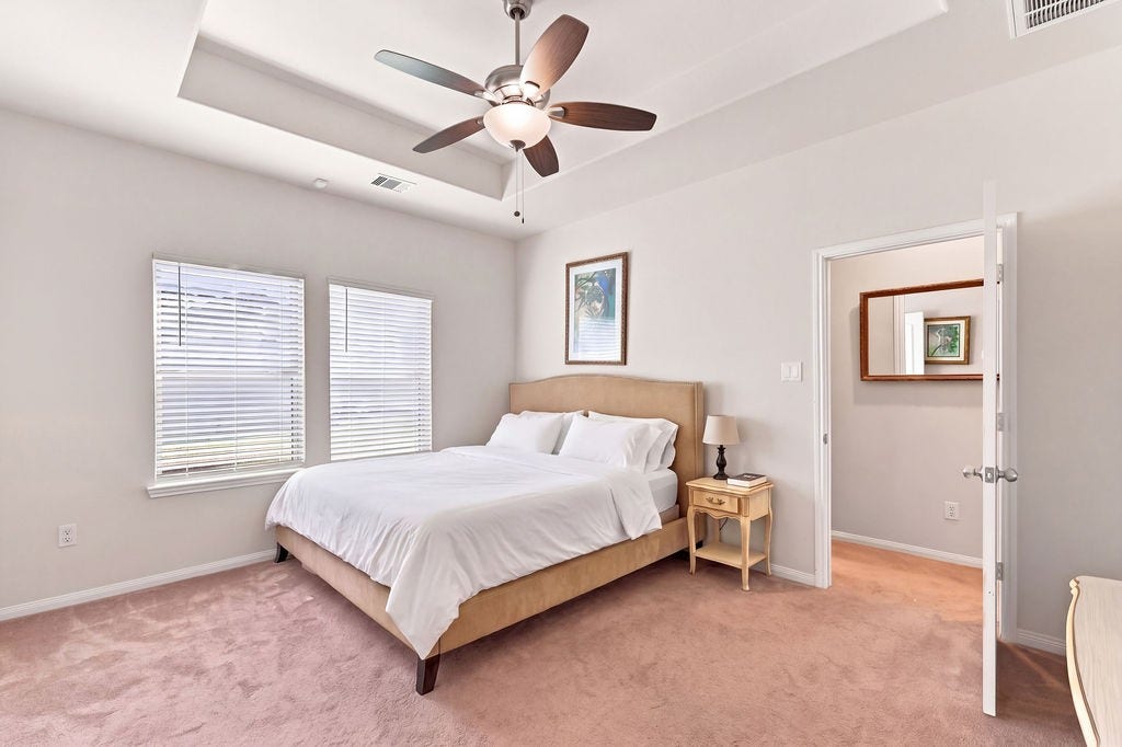 6623 Blimp Base Blvd, Hitchcock, TX 77563 Great look in the primary room with large windows. Virtually staged.