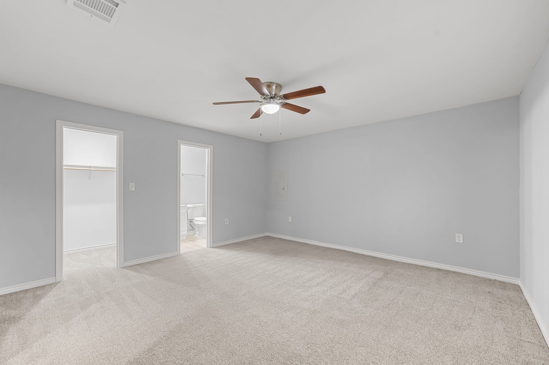 4802 Hannas Reef Drive, Bacliff, TX 77518 This additional view showcases the primary suite's walk-in closet, direct bathroom access, and ample wall space for arranging furniture to suit your needs.