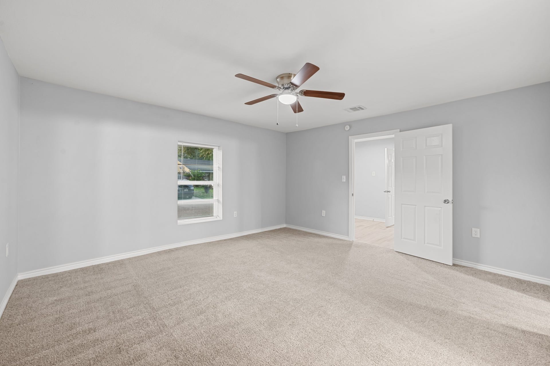 4802 Hannas Reef Drive, Bacliff, TX 77518 Another perspective highlights the primary bedroom's generous dimensions, providing plenty of flexibility for bedroom furniture and creating a comfortable personal retreat.