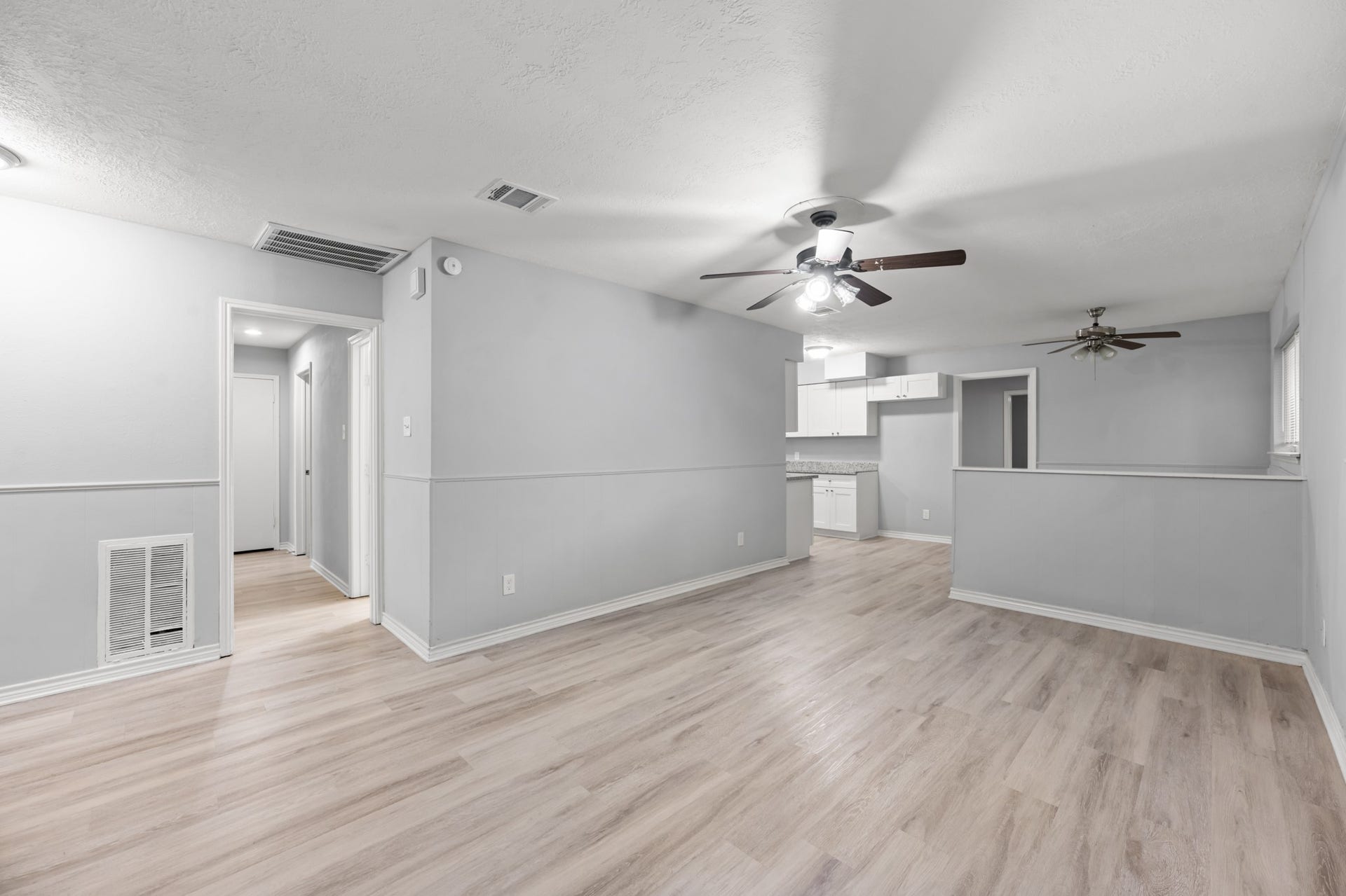 4802 Hannas Reef Drive, Bacliff, TX 77518 An open, flowing layout connects the living room to the kitchen and dining area, creating a versatile space for everyday living and entertaining.