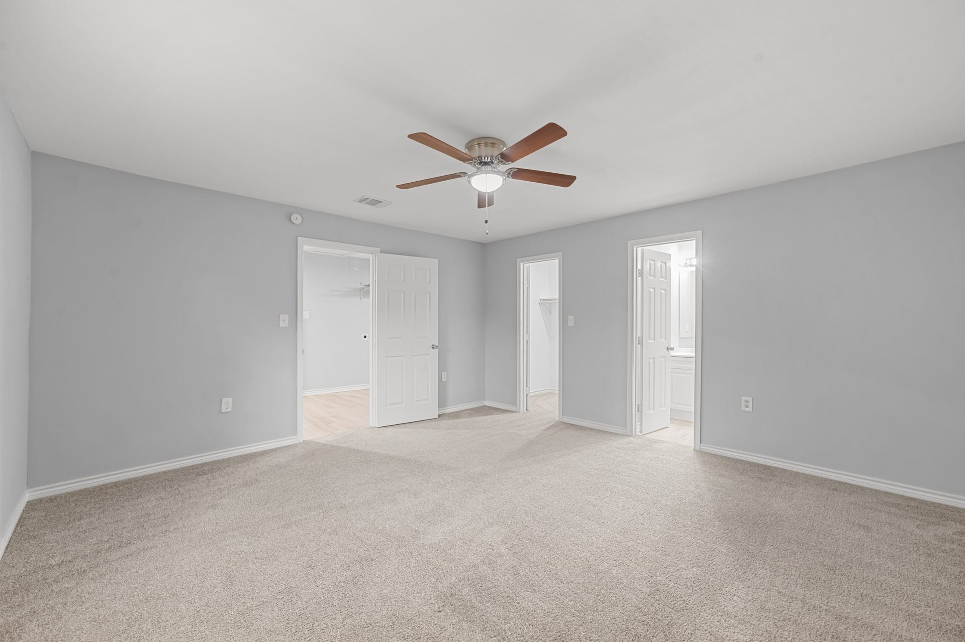 4802 Hannas Reef Drive, Bacliff, TX 77518 The primary suite features a spacious layout with convenient access to a private bathroom and walk-in closet, offering comfort and everyday functionality.