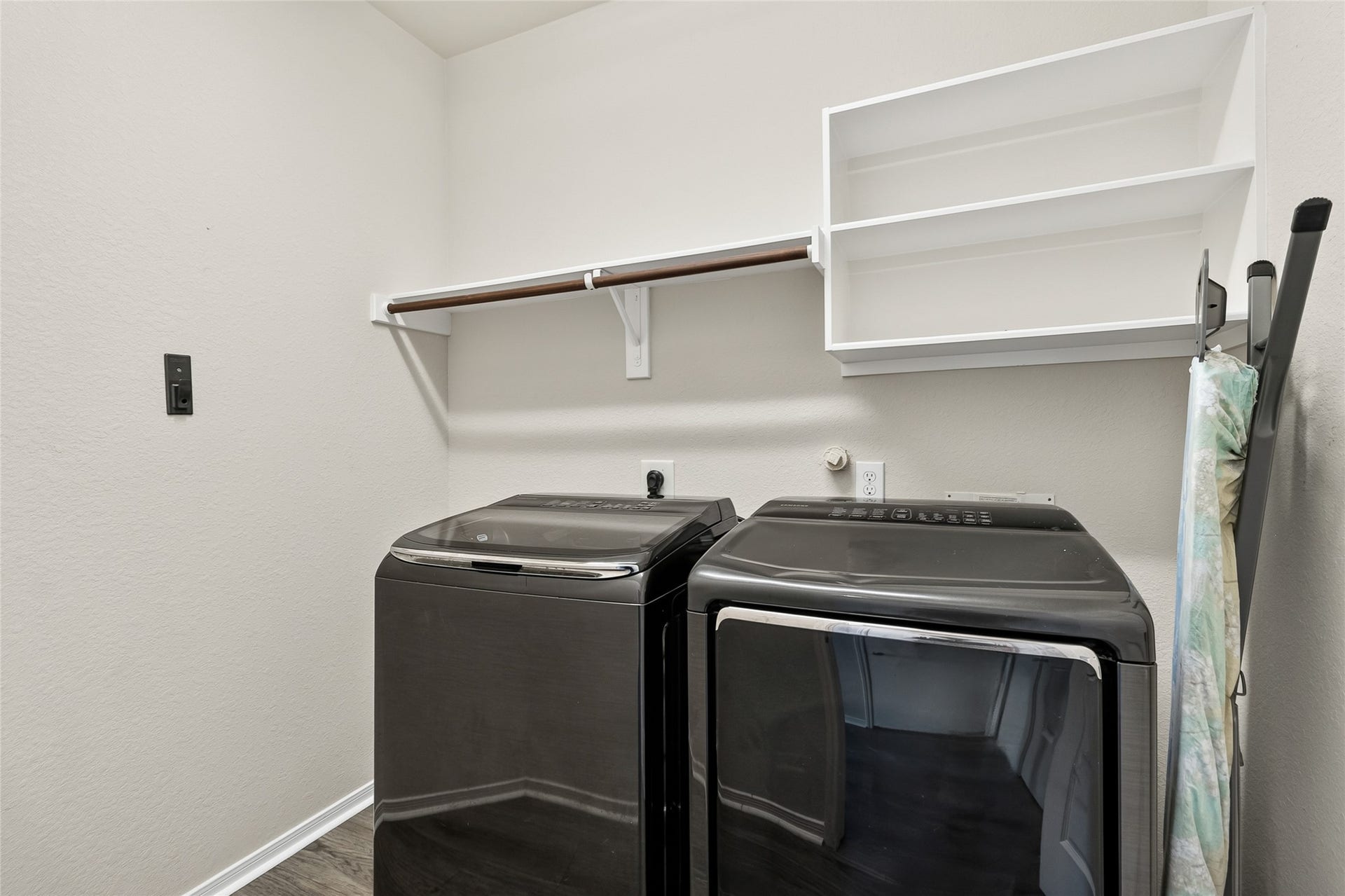 1231 Abigail Lane, Friendswood, TX 77546 Laundry day becomes more convenient with a dedicated utility room offering extra shelving and space to keep household essentials neatly organized.