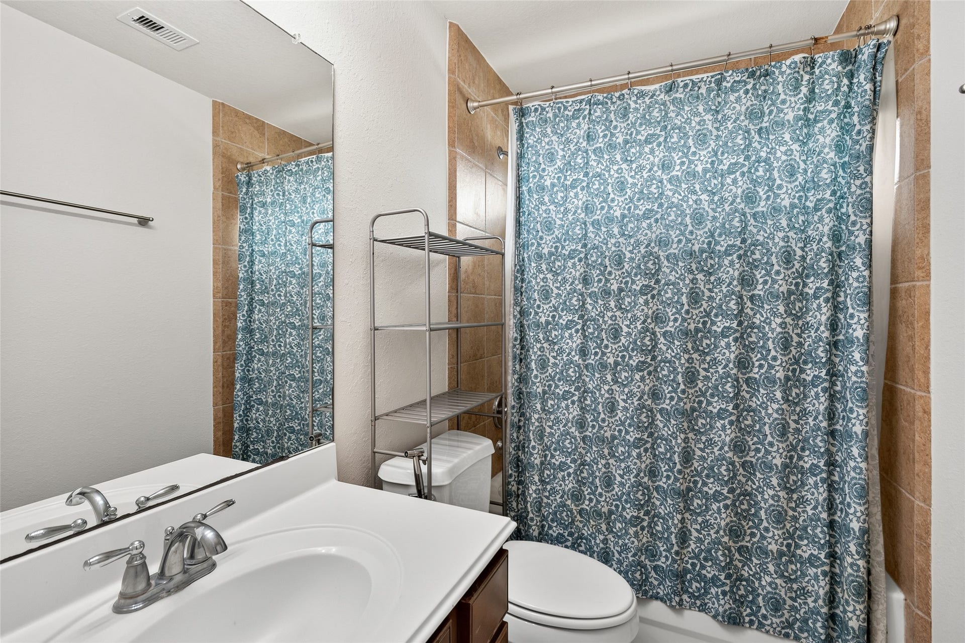 1231 Abigail Lane, Friendswood, TX 77546 Your upstairs full bath features a convenient tub and shower combination, providing comfort and functionality for everyday living.