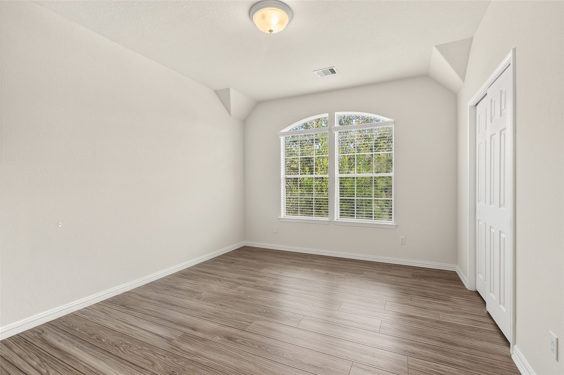 1231 Abigail Lane, Friendswood, TX 77546 This versatile secondary bedroom offers plenty of space for family, guests, or a comfortable home office tailored to your lifestyle.