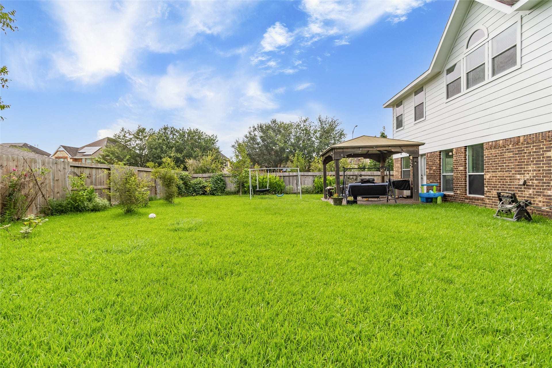 1231 Abigail Lane, Friendswood, TX 77546 Weekend gatherings are easy with a spacious backyard, covered gazebo, and plenty of open green space for everyone to enjoy.
