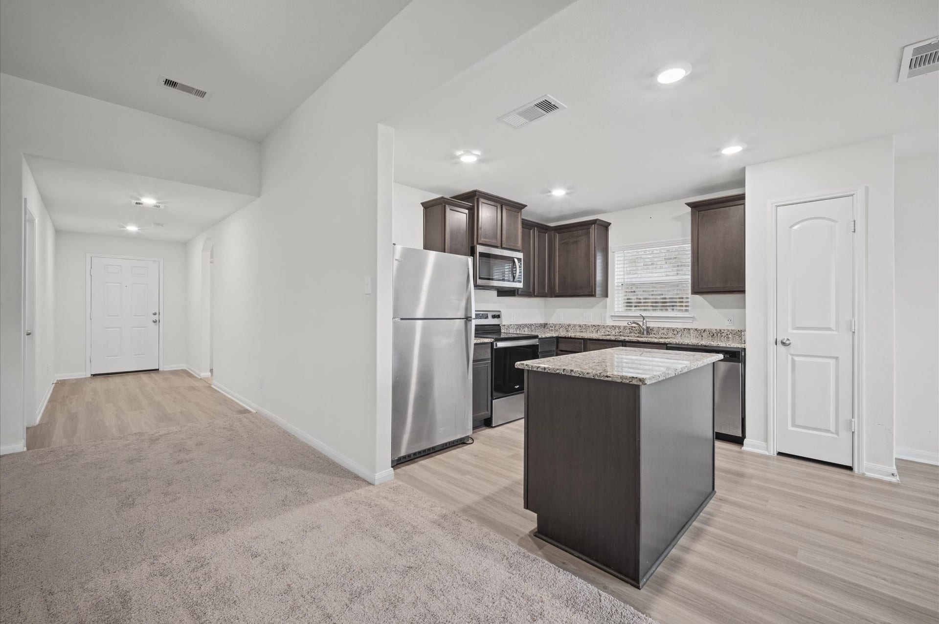 327 Spanish Stone Drive, Katy, TX 77493 Solid surface entry way and brand new carpet in the family room. Large kitchen with a useable Island. Refrigerator is included.