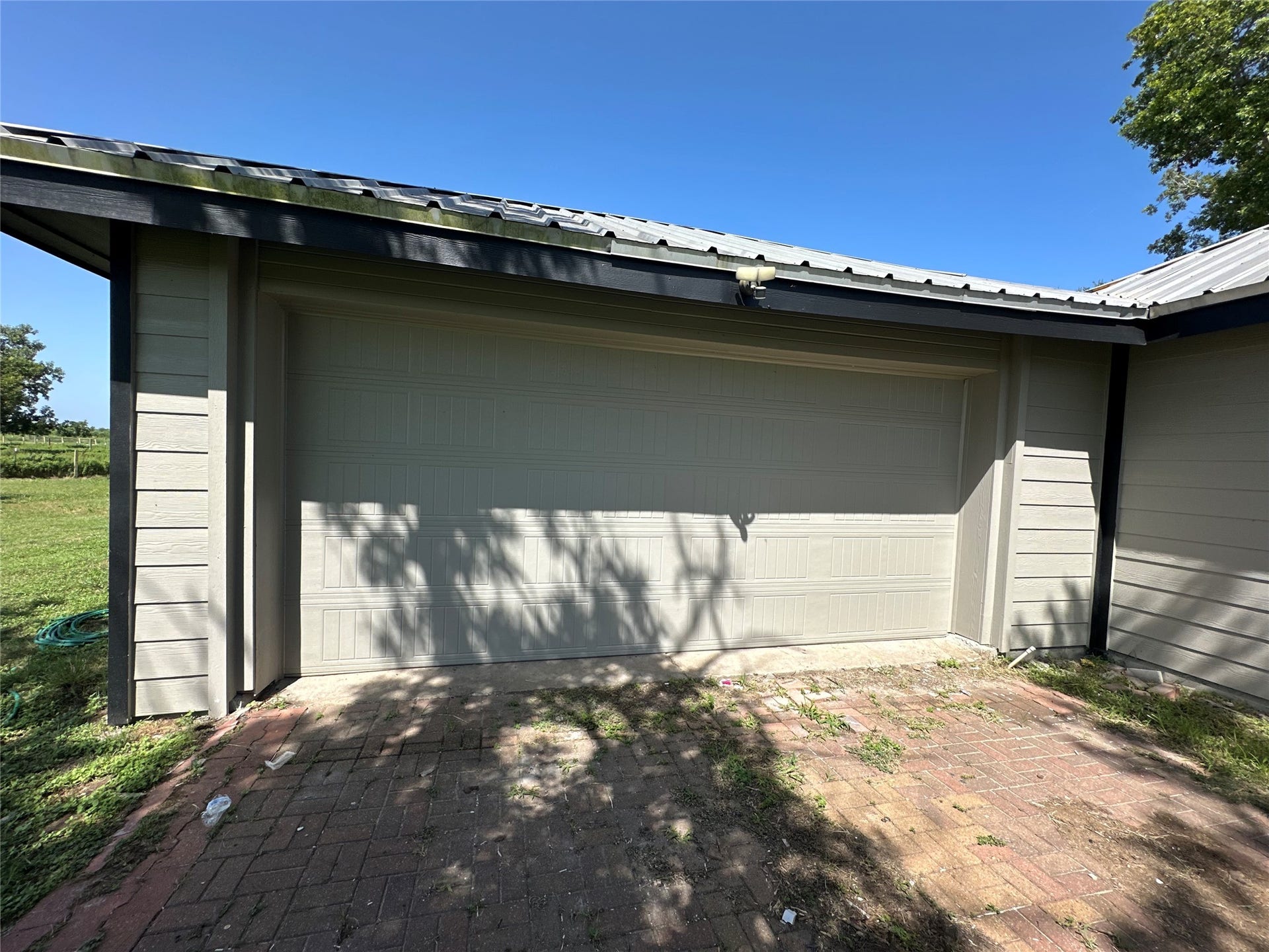40344 Harpers Church Road, Hempstead, TX 77445 The house features an attached two car garage