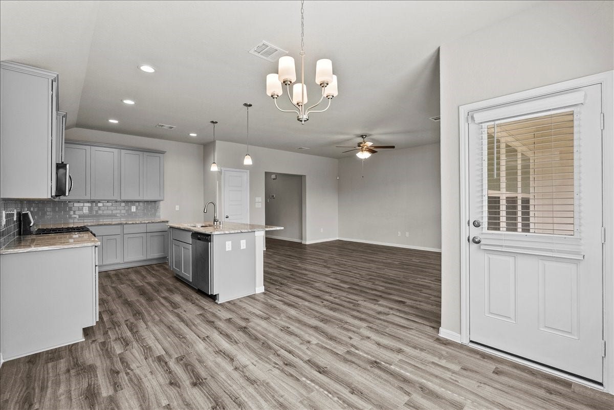 angle of kitchen / formal dining area to go into back yard