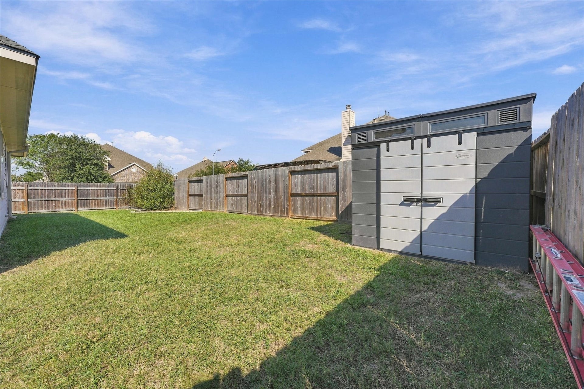 Comes with a clean, functional shed in the back
