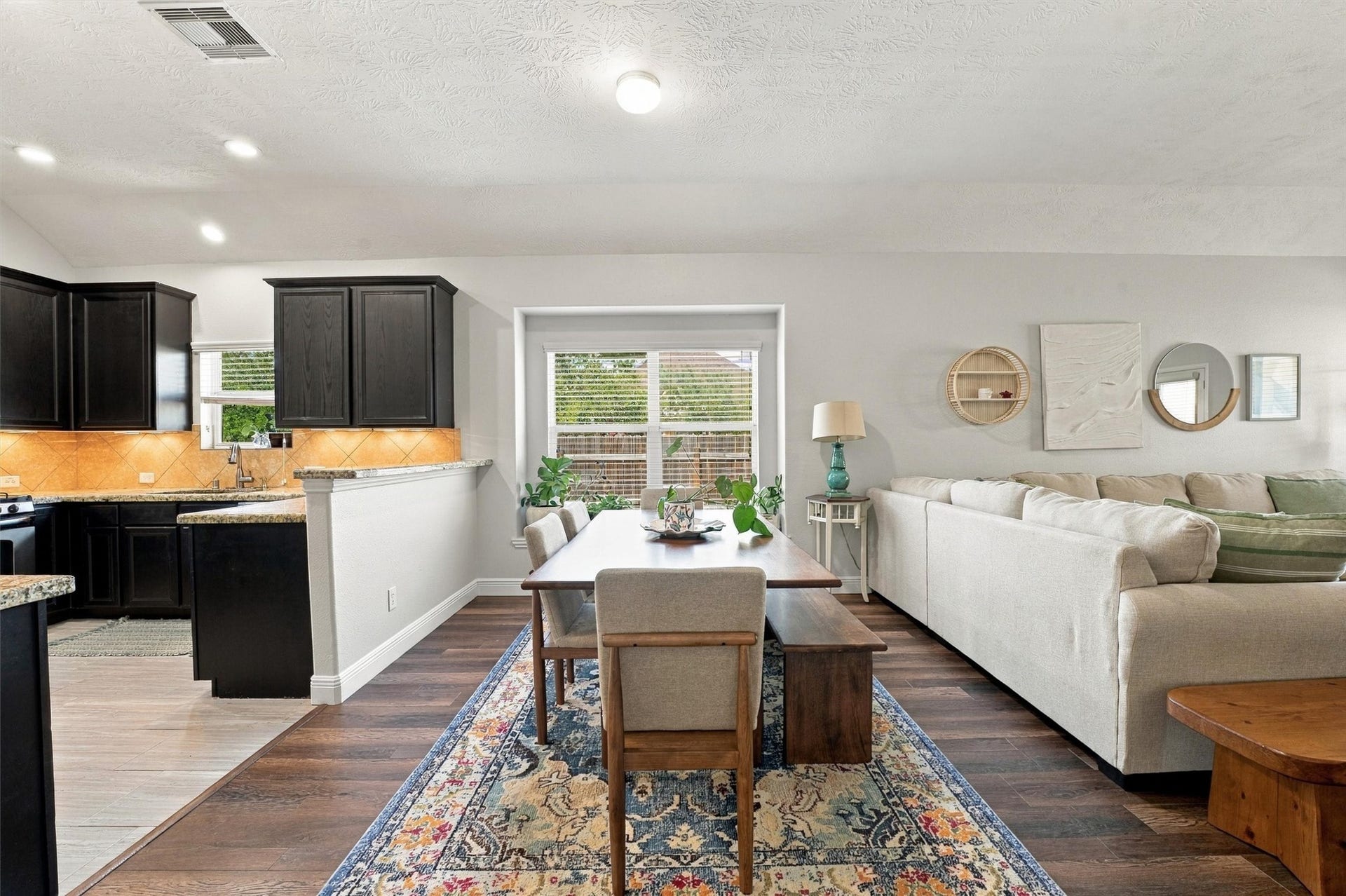 Open-concept kitchen overlooks the spacious living area, ideal for everyday living and entertaining.