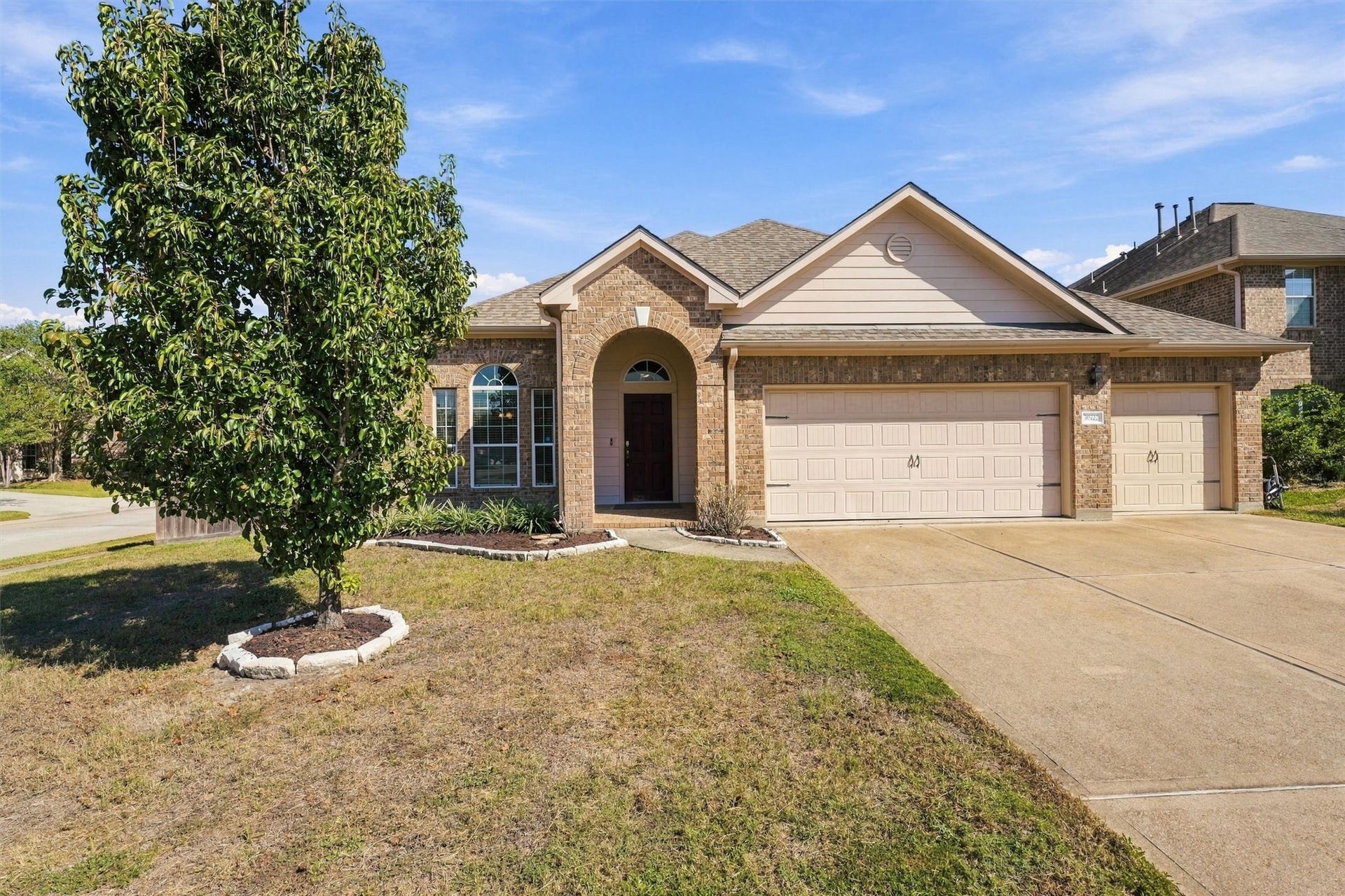 Beautifully refreshed home situated on a desirable corner lot with a 3-car attached garage.