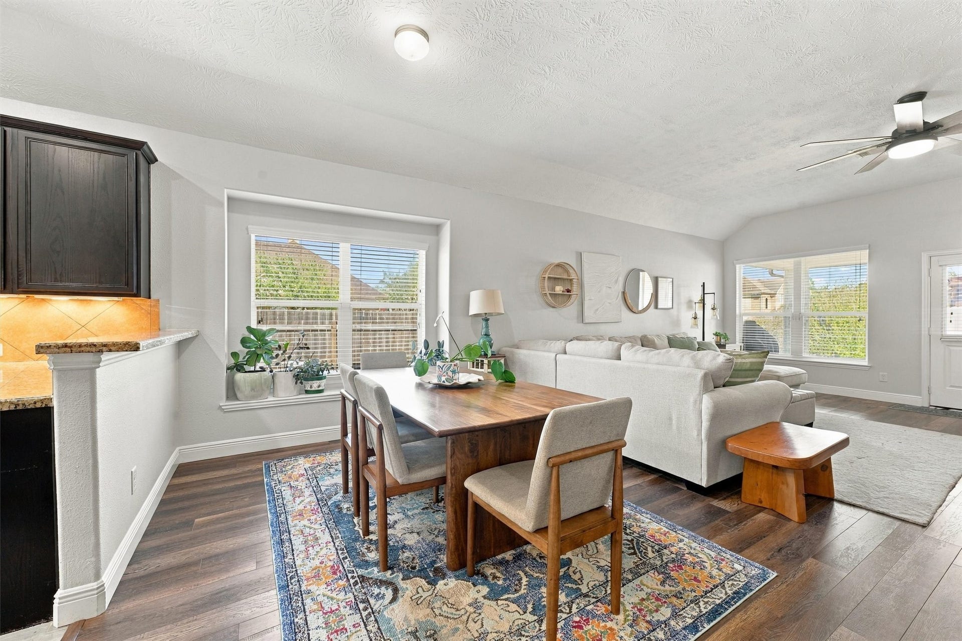 Charming breakfast nook provides a welcoming space for casual dining; tons of natural light.