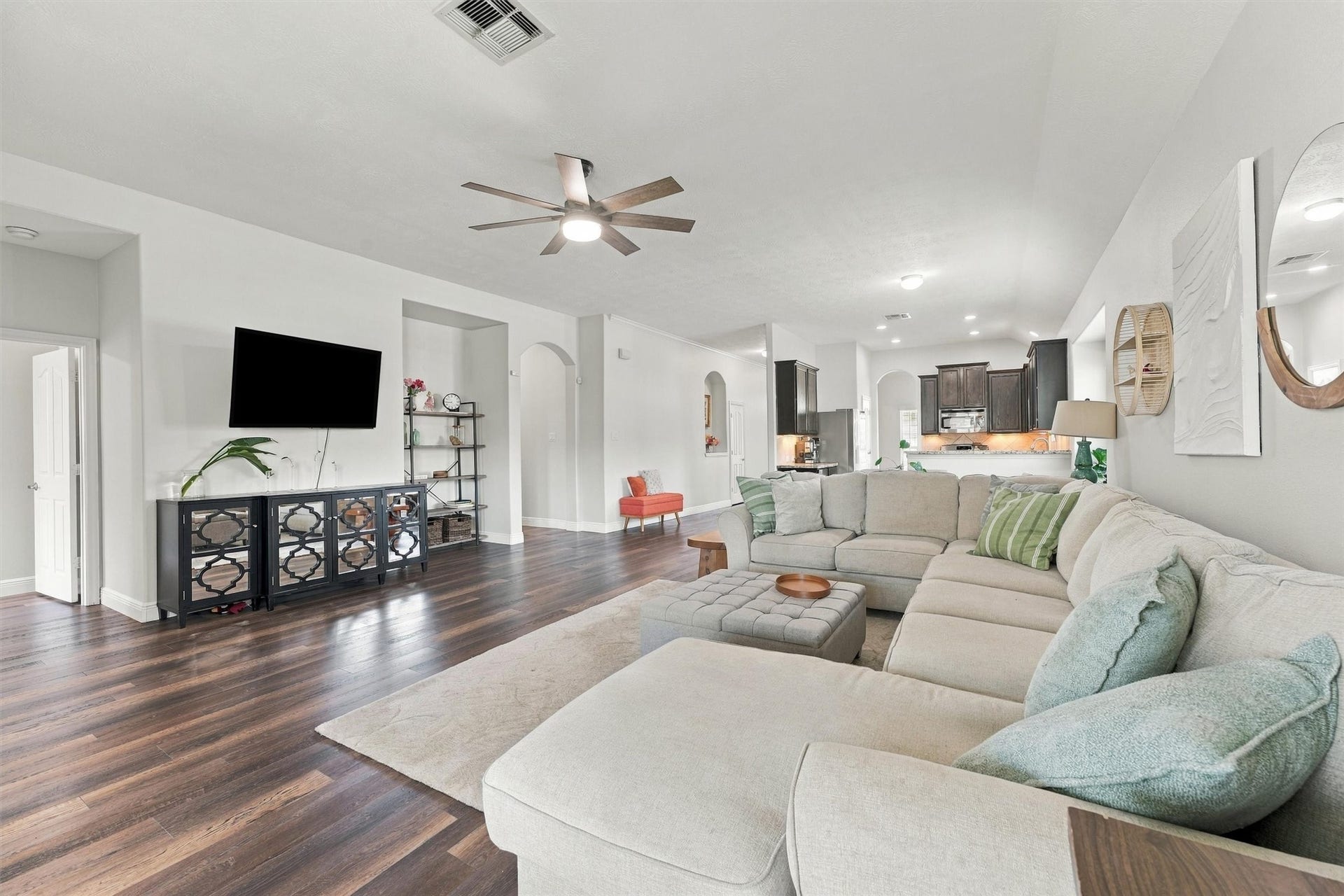Light-filled living area flows seamlessly into the kitchen and breakfast nook.