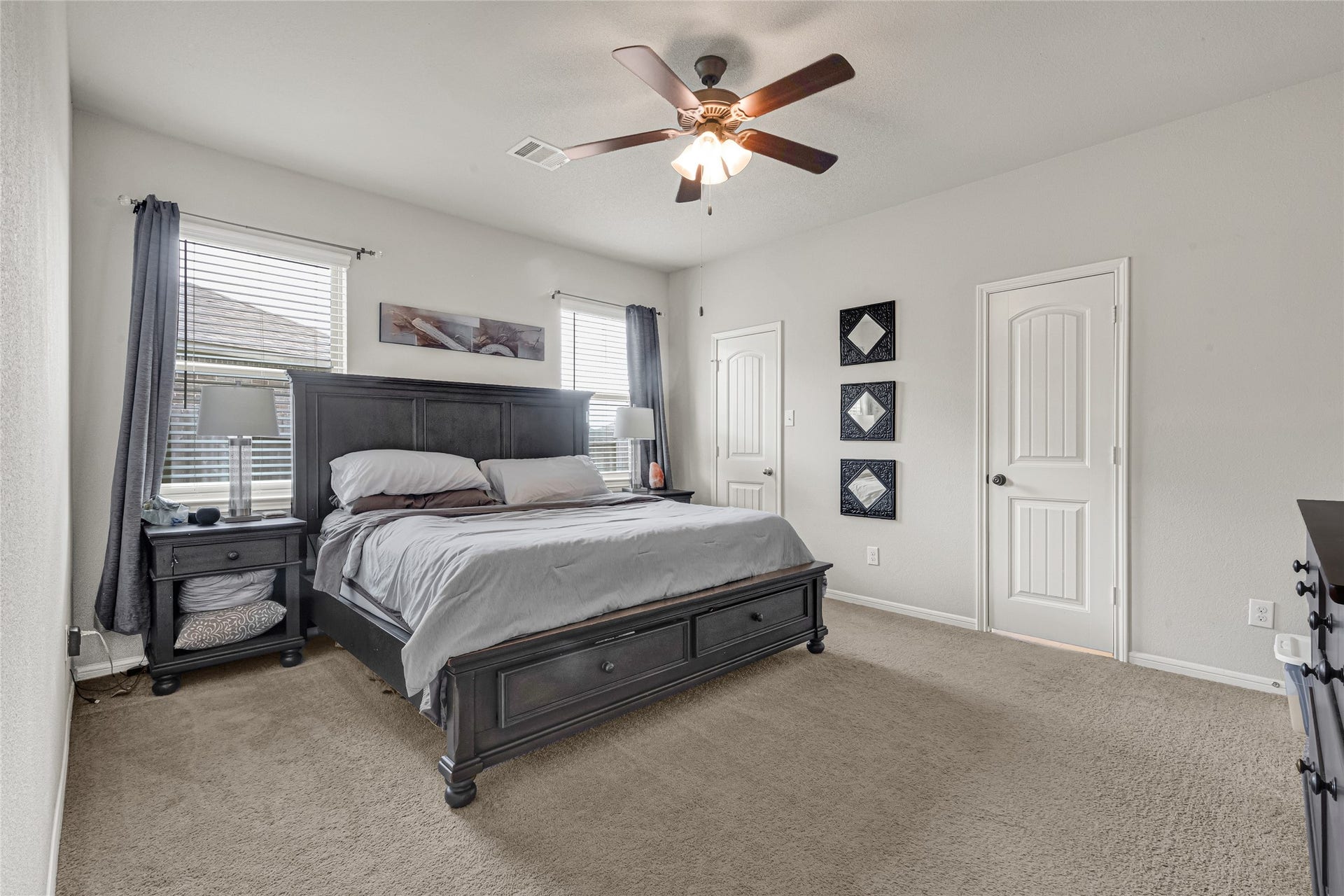 5318 Abbeville Court, Dickinson, TX 77539 Generously sized primary suite with plush carpeting and abundant natural light.