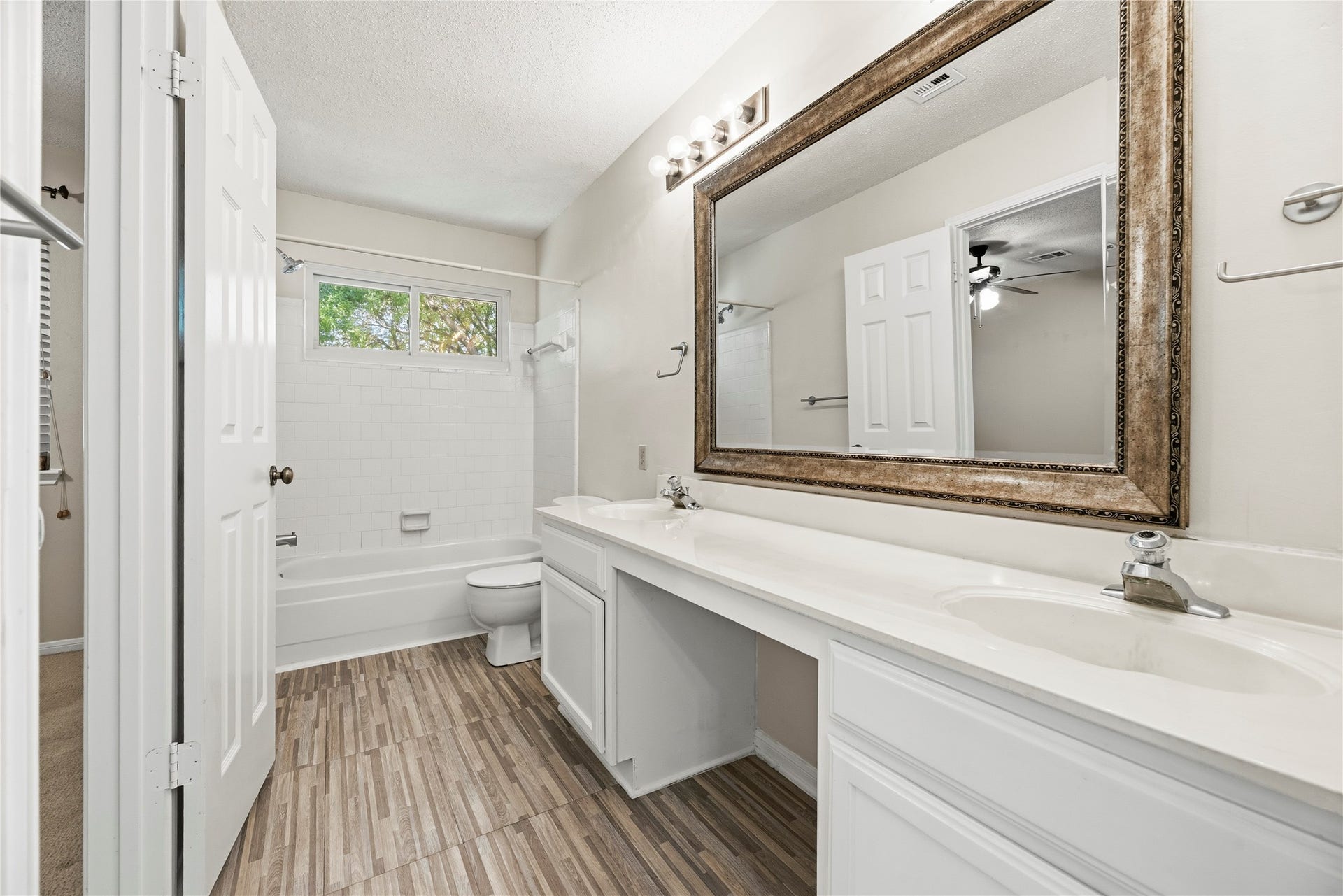 Upstairs full bathroom shared by the secondary bedrooms.