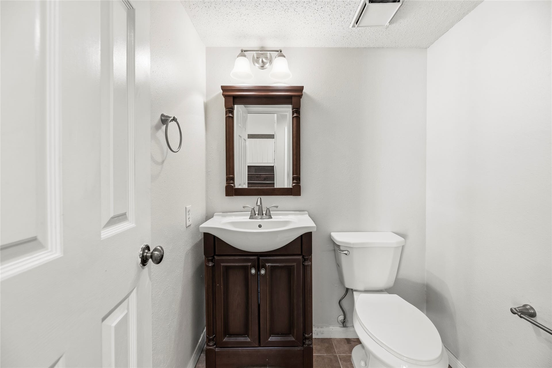 Downstairs half bathroom.